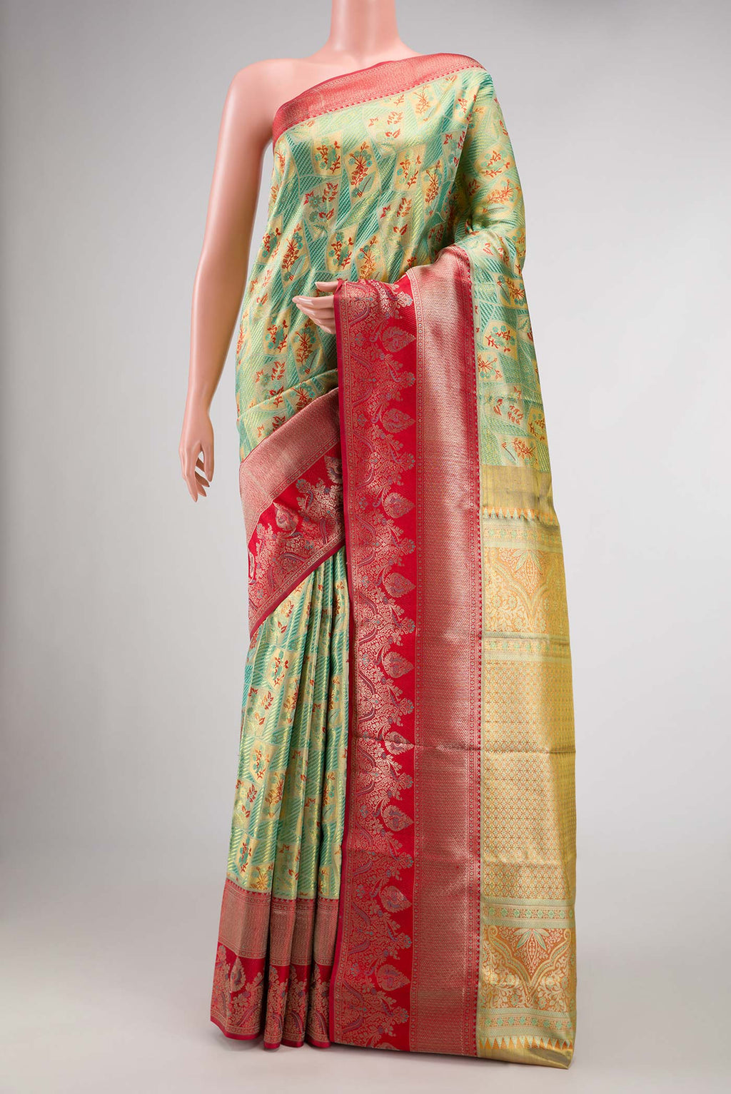 Green Dual Tone Kanchipuram Tissue Silk Saree with Zari Brocade on the body and Fancy Border.  displayed on a mannequin