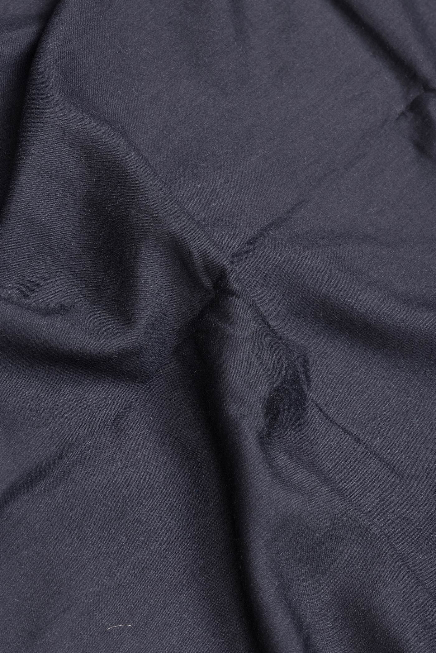 Close up of Grey Dual Tone Tussar Silk Saree with Plain Body and Fancy Border.  displaying folds