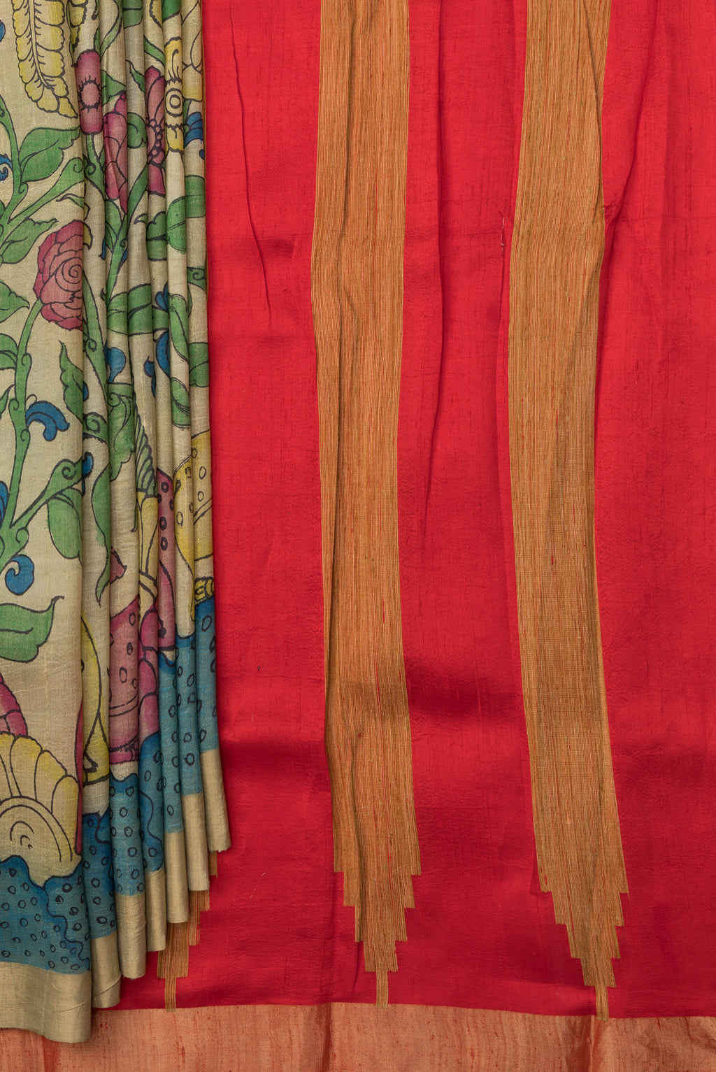 Pleats and pallu of Beige Dual Tone Raw Silk Saree with kalamkari Print on the body and Zari Border. 