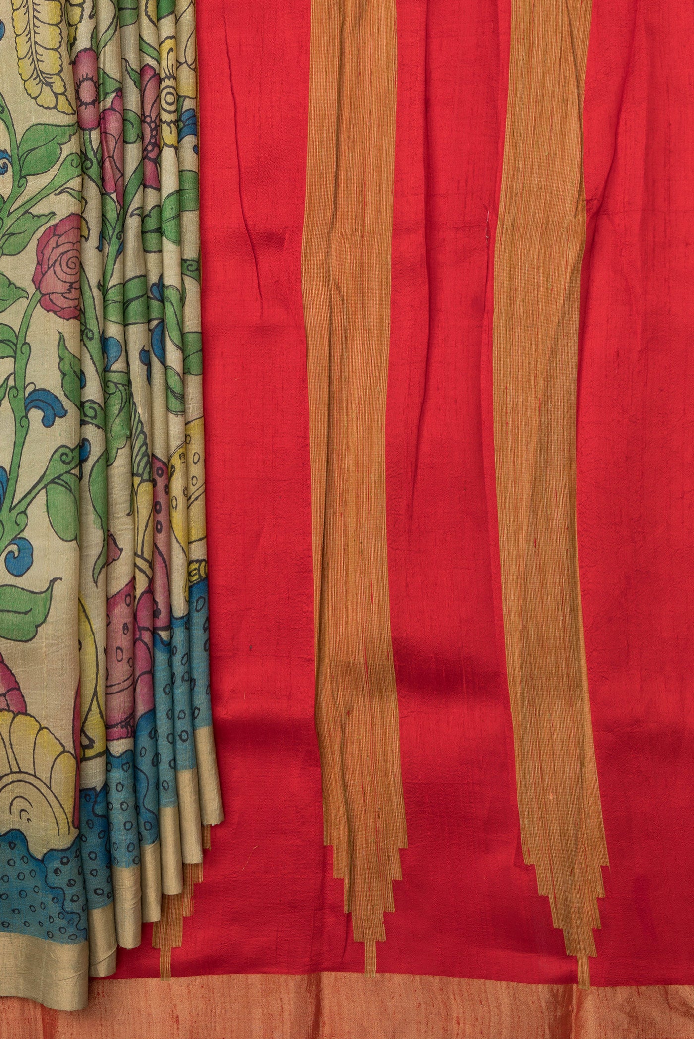 Pleats and pallu of Beige Dual Tone Raw Silk Saree with kalamkari Print on the body and Zari Border. 