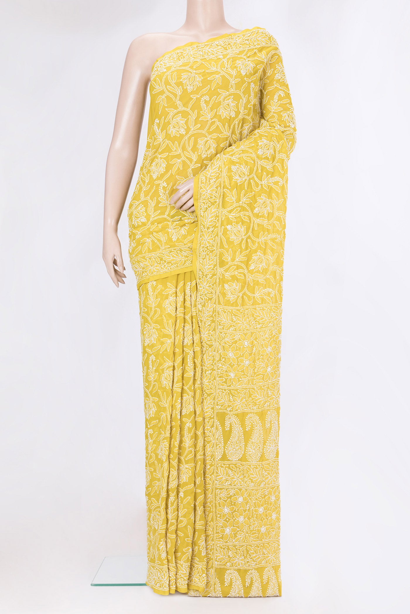 Lemon Yellow Georgette Saree with Embroidery on the body and Embroidery Border.  displayed on a mannequin