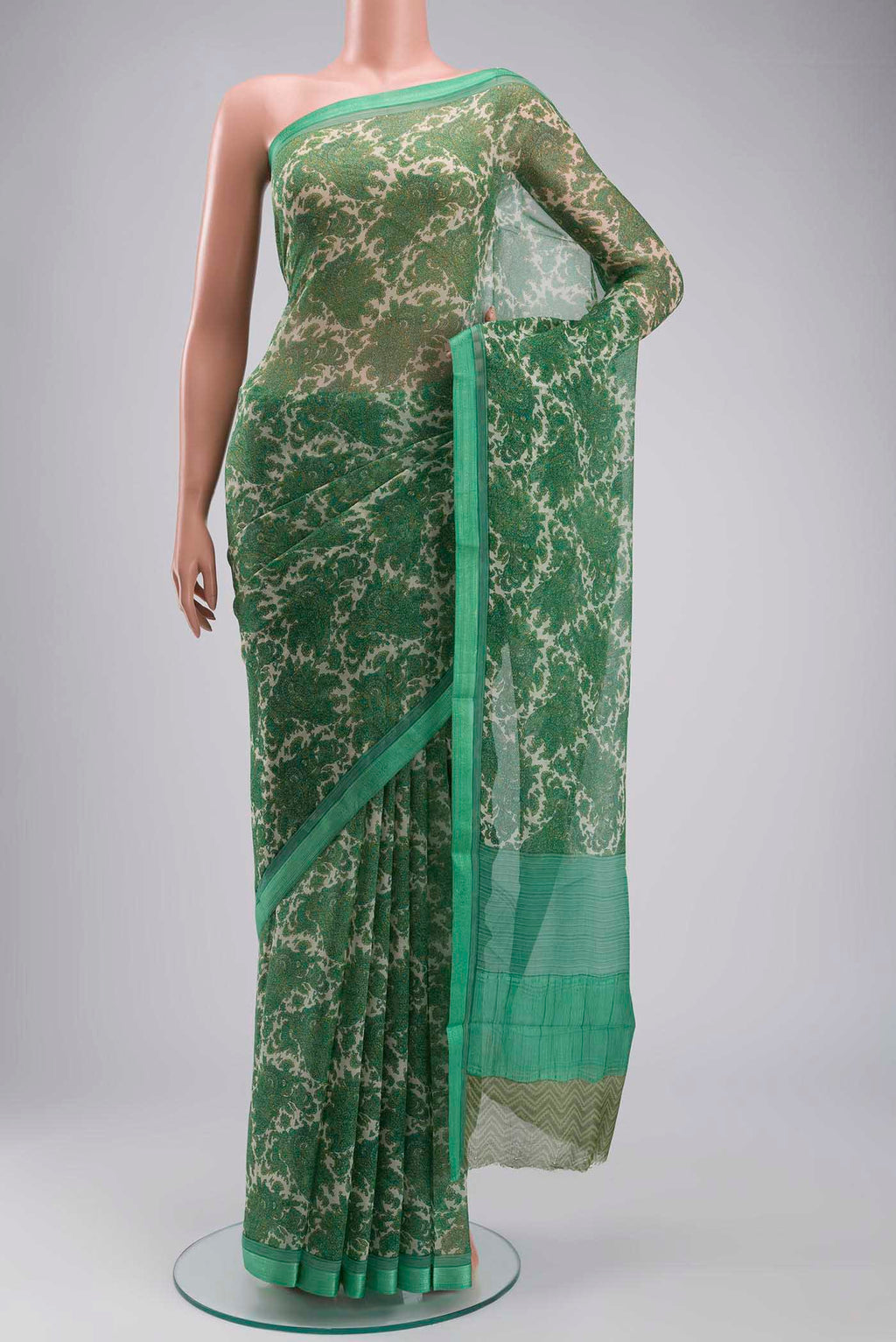 Green Mysore Chiffon Saree with Printed design on the body and Embroidery Border displayed on a mannequin