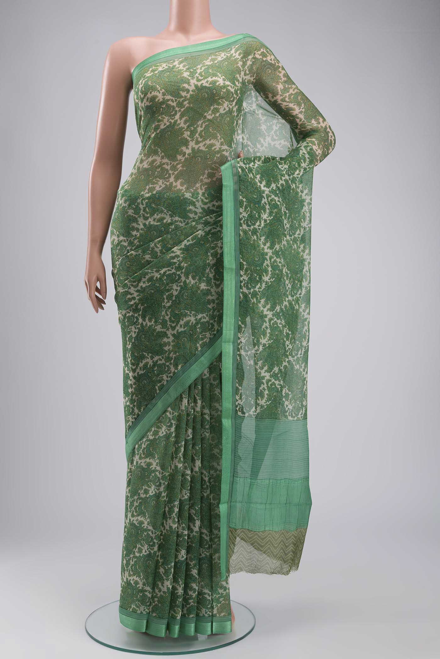 Green Mysore Chiffon Saree with Printed design on the body and Embroidery Border displayed on a mannequin