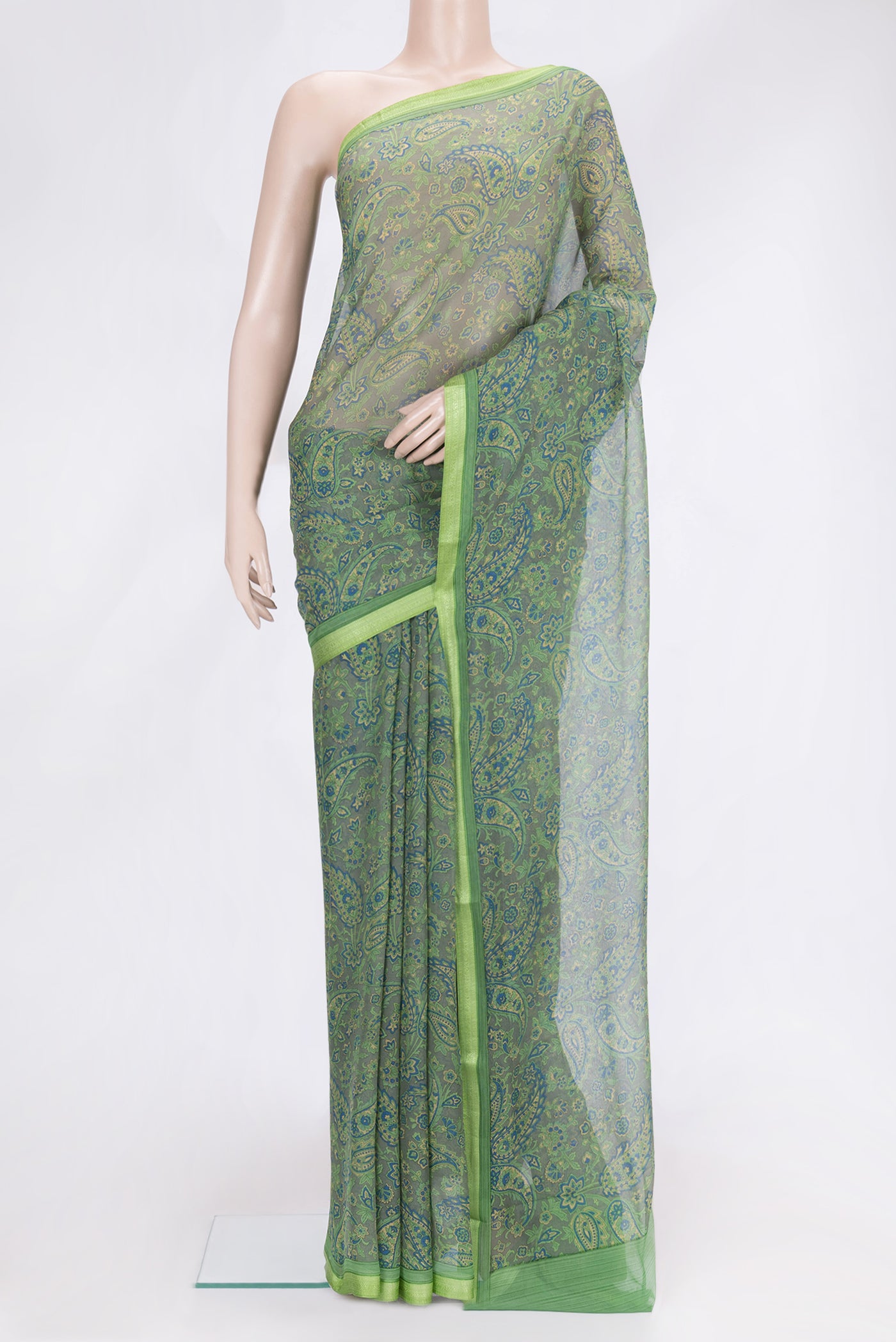 Light Green Dual Tone Mysore Chiffon Saree with Printed design on the body and Printed Border.  displayed on a mannequin