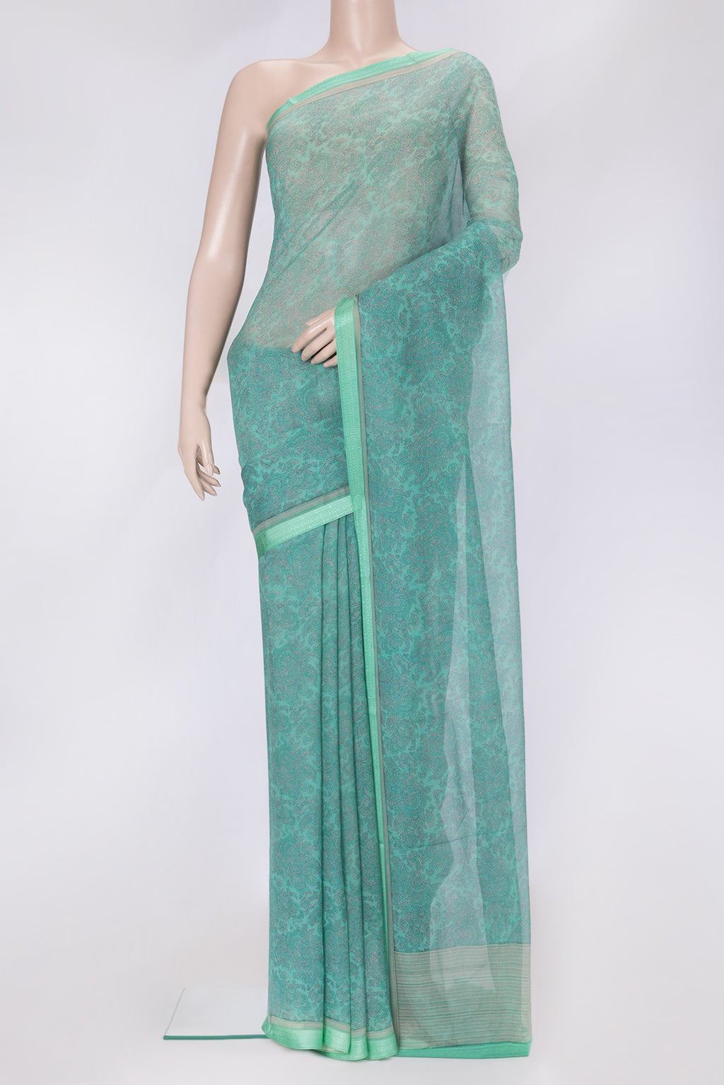 Sea Green Dual Tone Mysore Chiffon Saree with Printed design on the body and Thread Border.  displayed on a mannequin