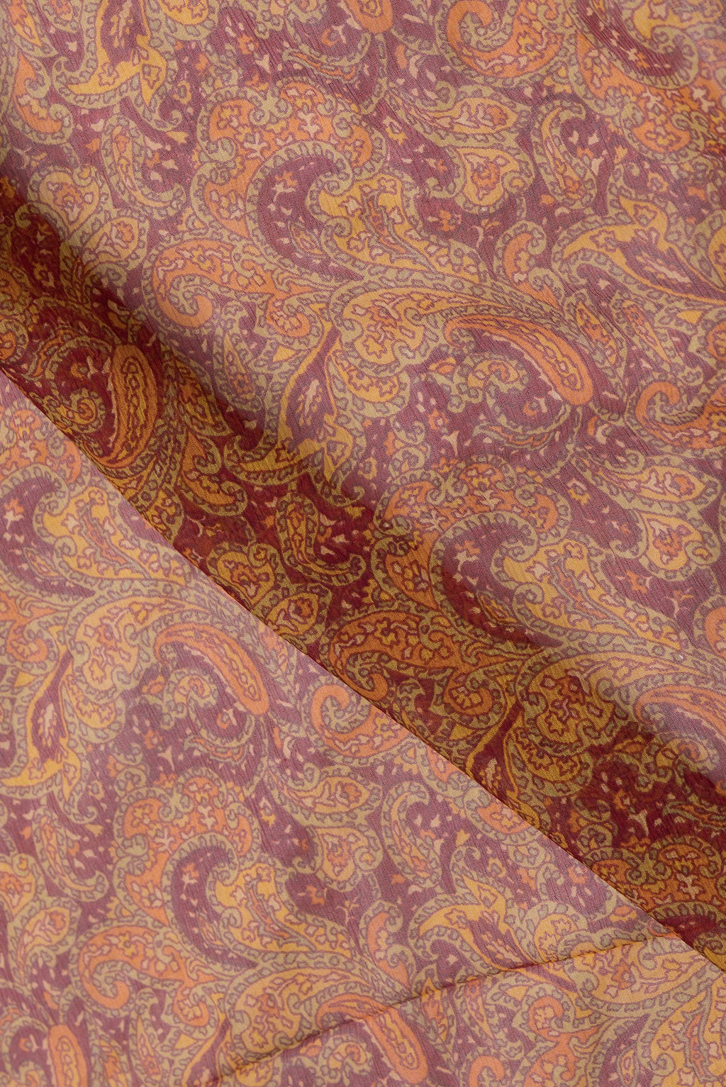 Close up of Maroon Dual Tone Mysore Chiffon Saree with Printed design on the body and Zari Border.  displaying folds