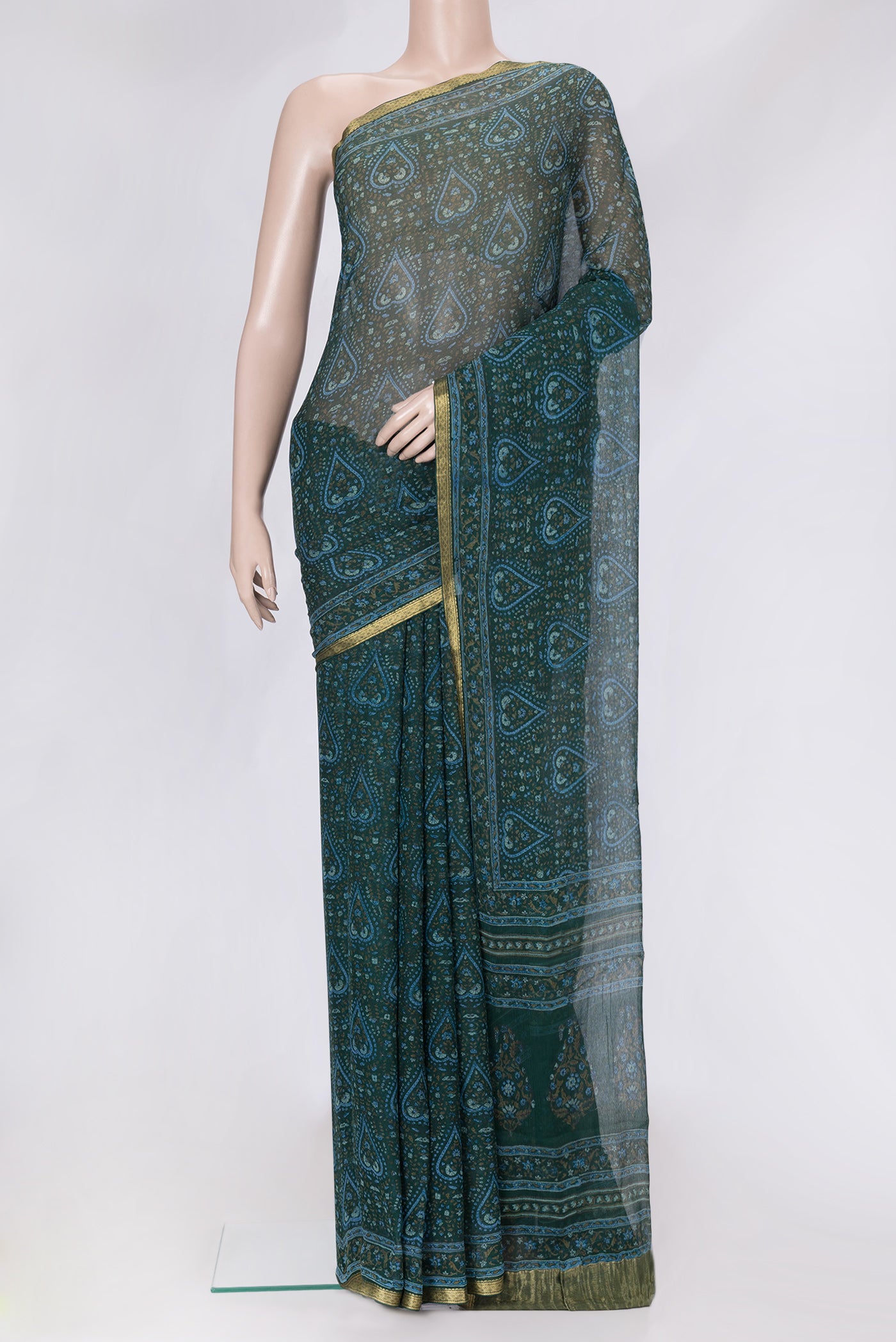 Bottle Green Dual Tone Mysore Chiffon Saree with Printed design on the body and Zari Border.  displayed on a mannequin