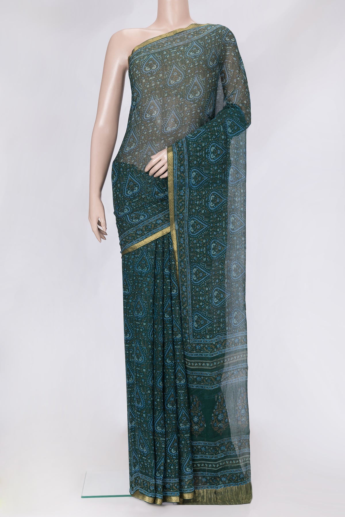 Bottle Green Dual Tone Mysore Chiffon Saree with Printed design on the body and Zari Border.  displayed on a mannequin
