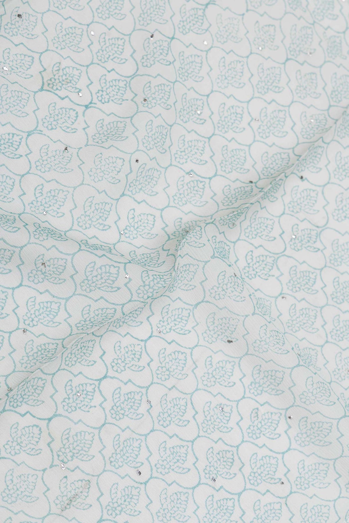 Close up of Grey Dual Tone Mysore Crepe Saree with Printed design on the body and Zari Border displaying folds