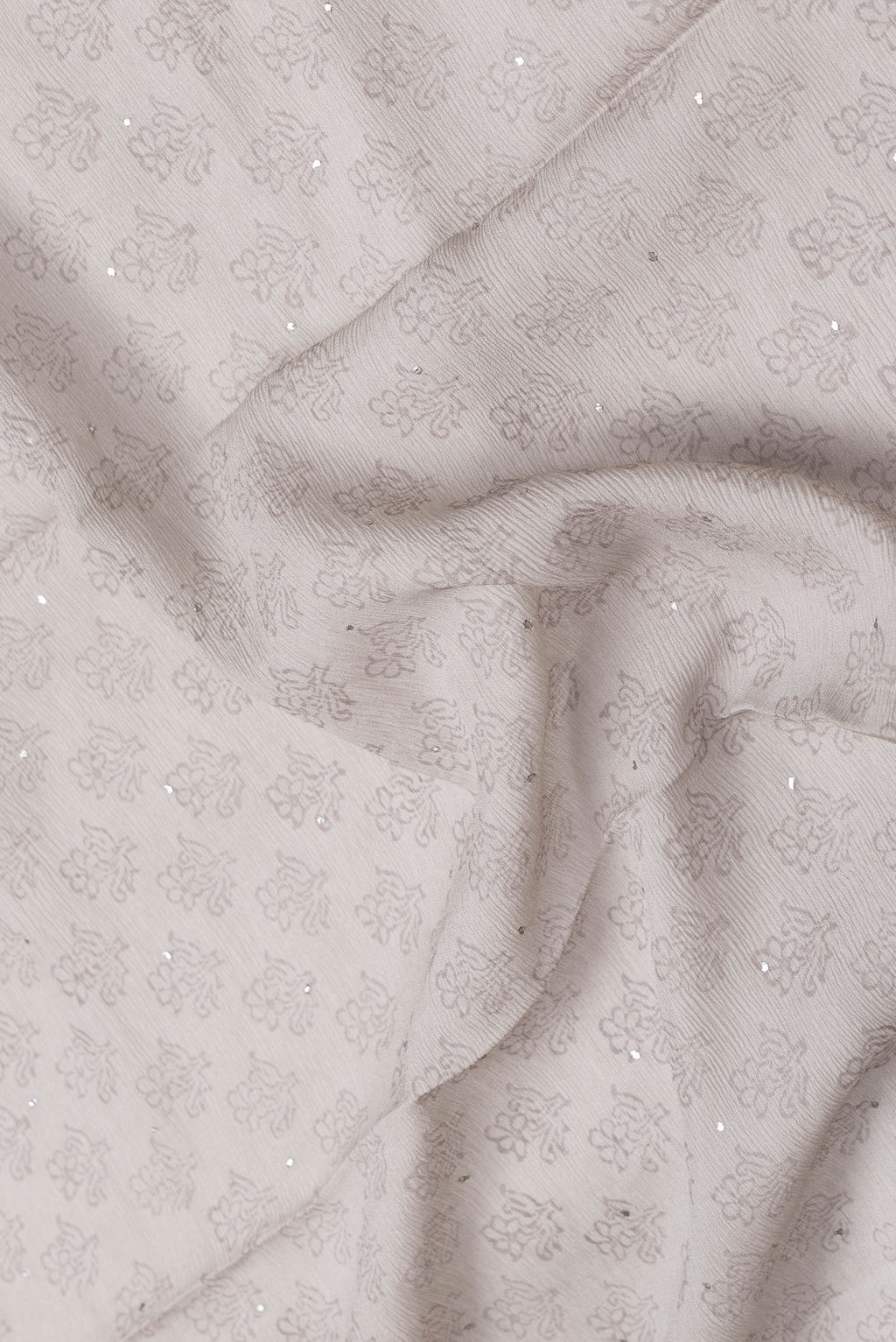 Close up of Grey Dual Tone Mysore Chiffon Saree with Embroidery on the body and Embroidery Border.  displaying folds
