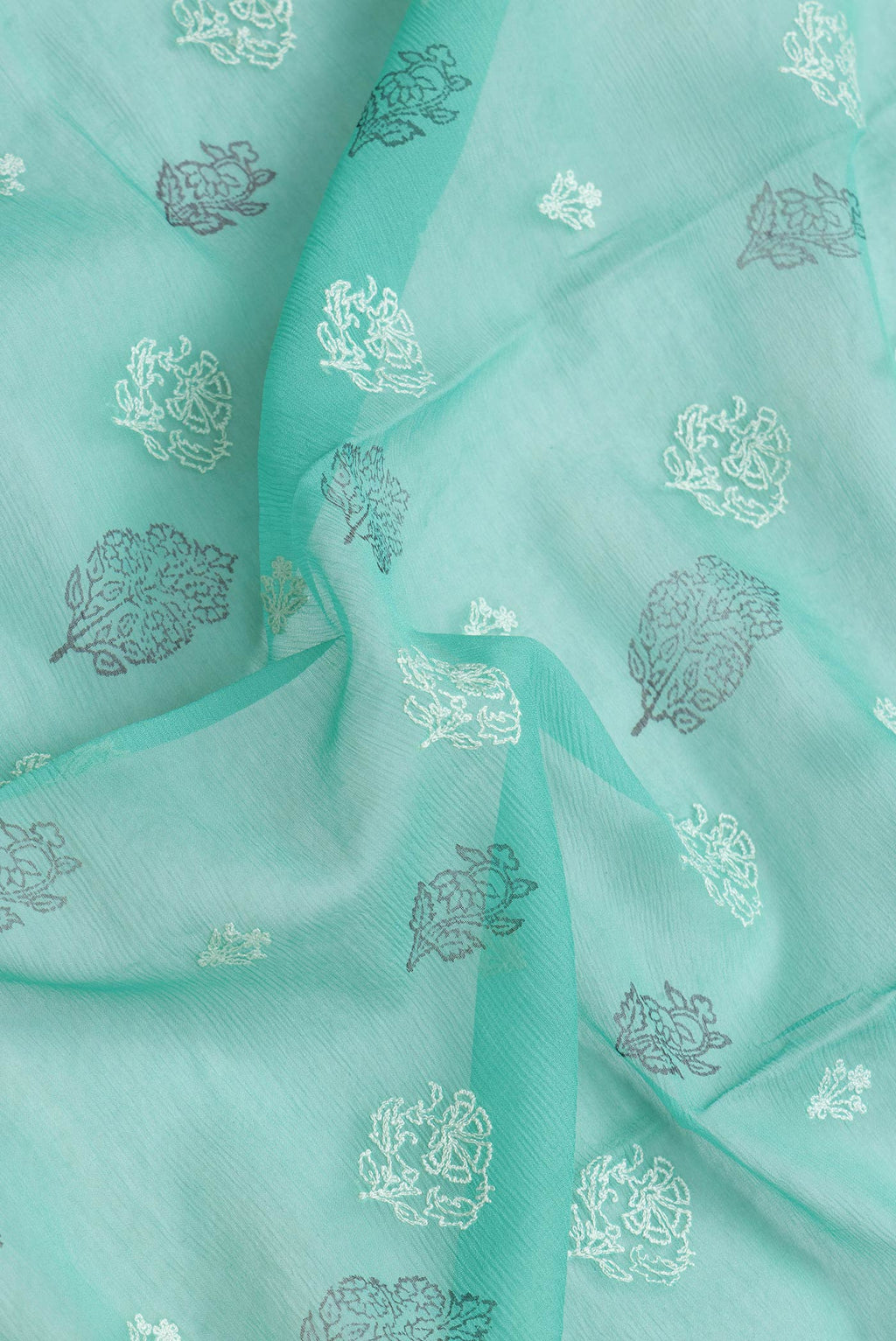 Close up of Sea Green Dual Tone Mysore Chiffon Saree with Embroidery on the body and Embroidery Border.  displaying folds