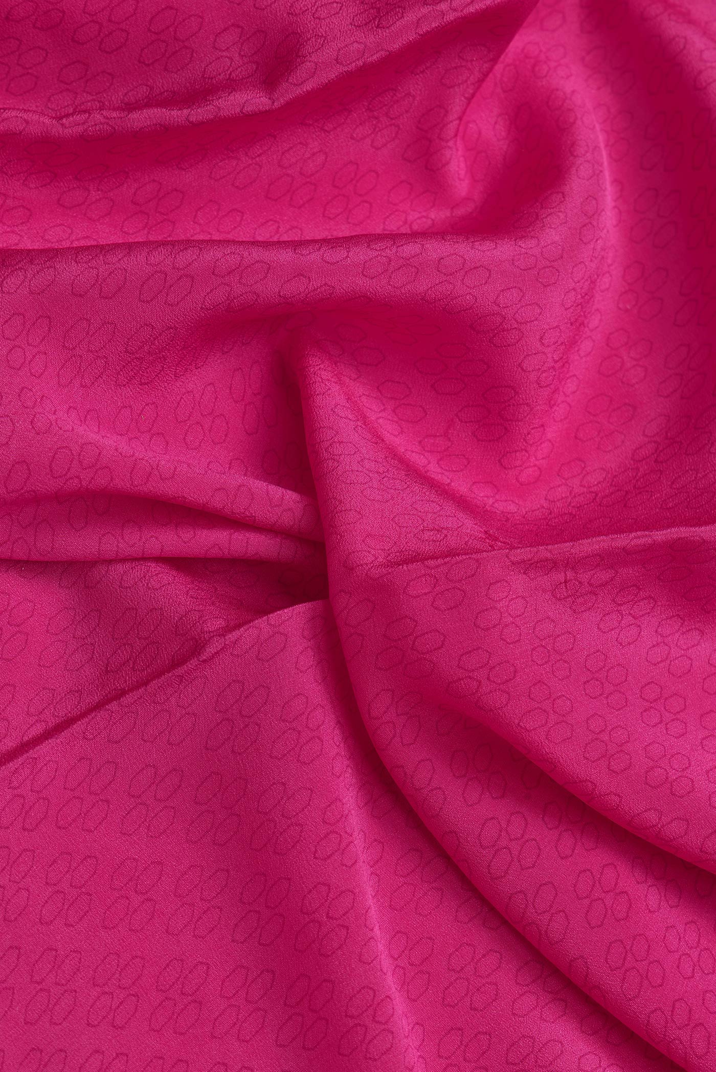 Close up of Pink Dual Tone Mysore Chiffon Saree with Printed design on the body and Embroidery Border.  displaying folds