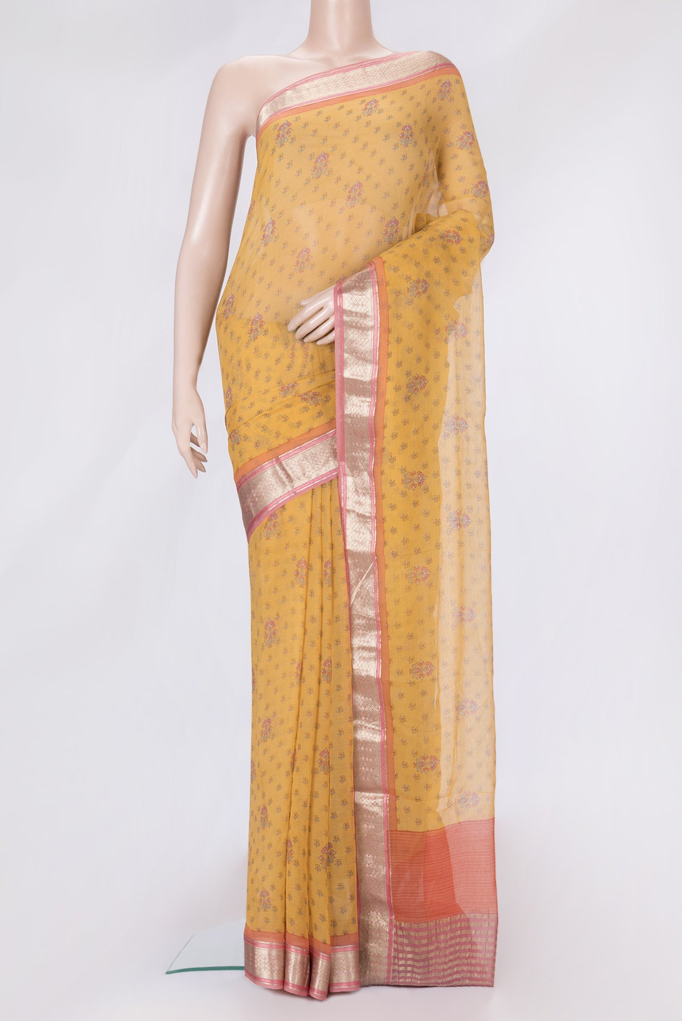 Mustard Dual Tone Mysore Chiffon Saree with Printed design on the body and Zari Border.  displayed on a mannequin