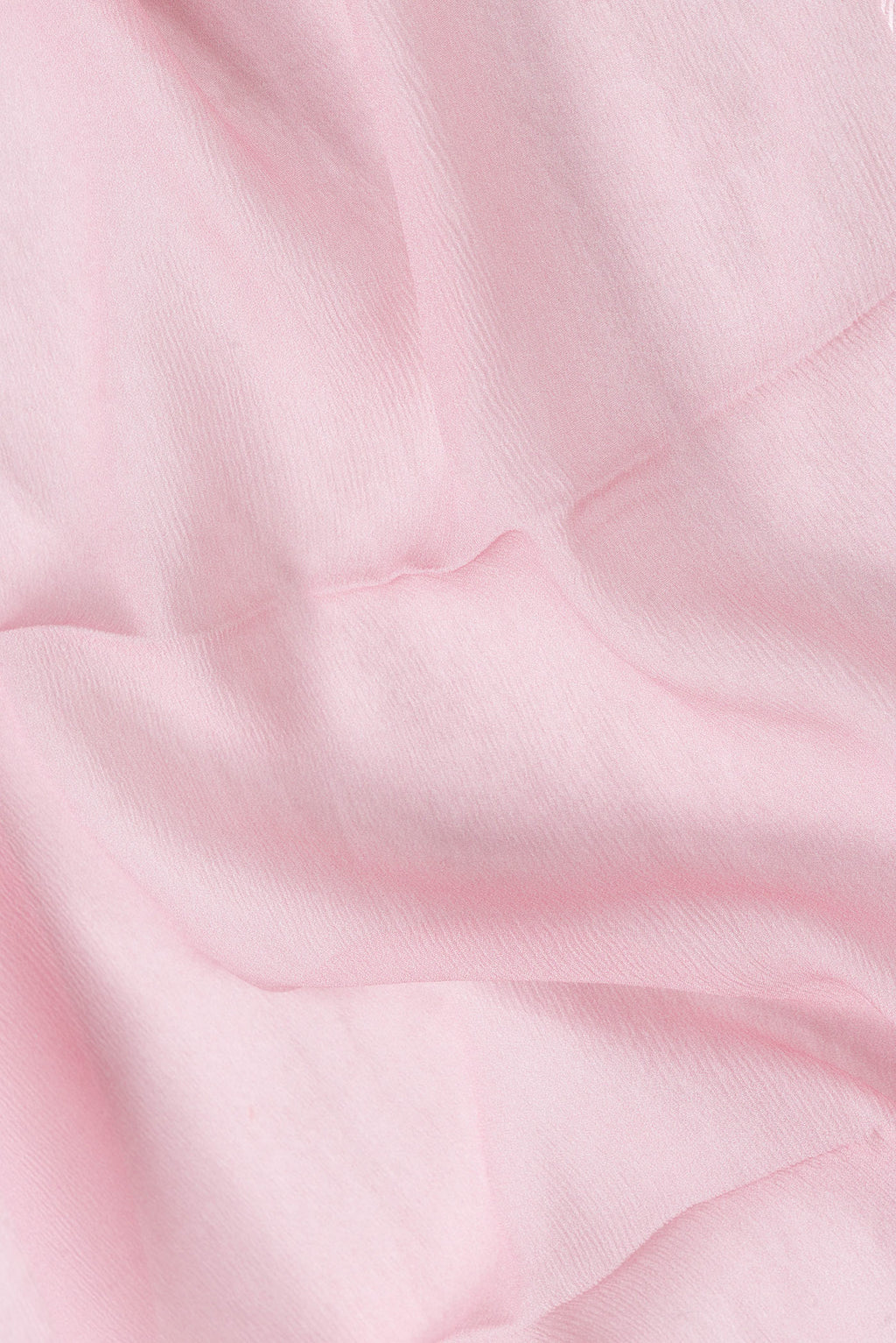 Close up of Pink Dual Tone Mysore Chiffon Saree with Plain Body and Printed Border.  displaying folds