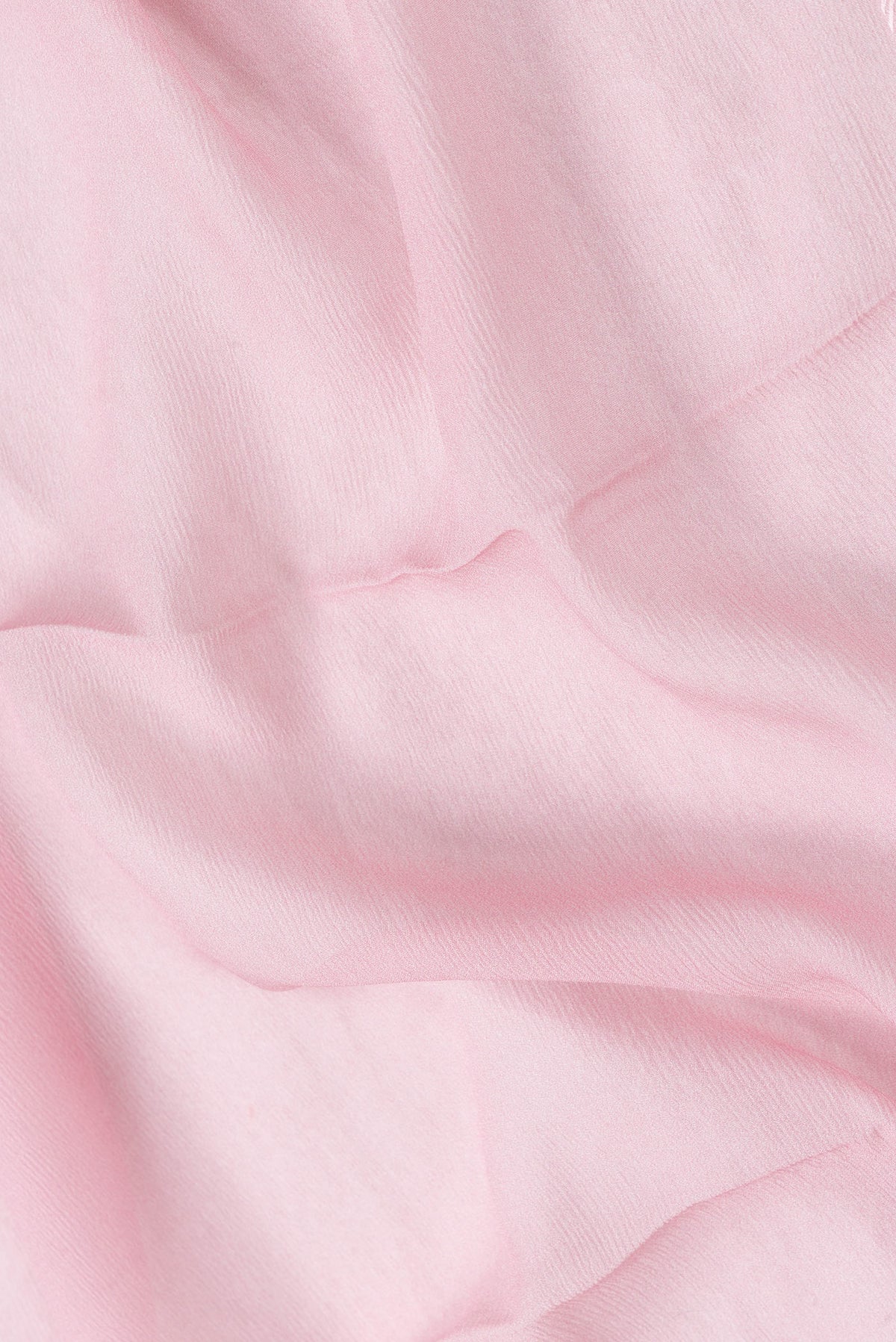Close up of Pink Dual Tone Mysore Chiffon Saree with Plain Body and Printed Border.  displaying folds