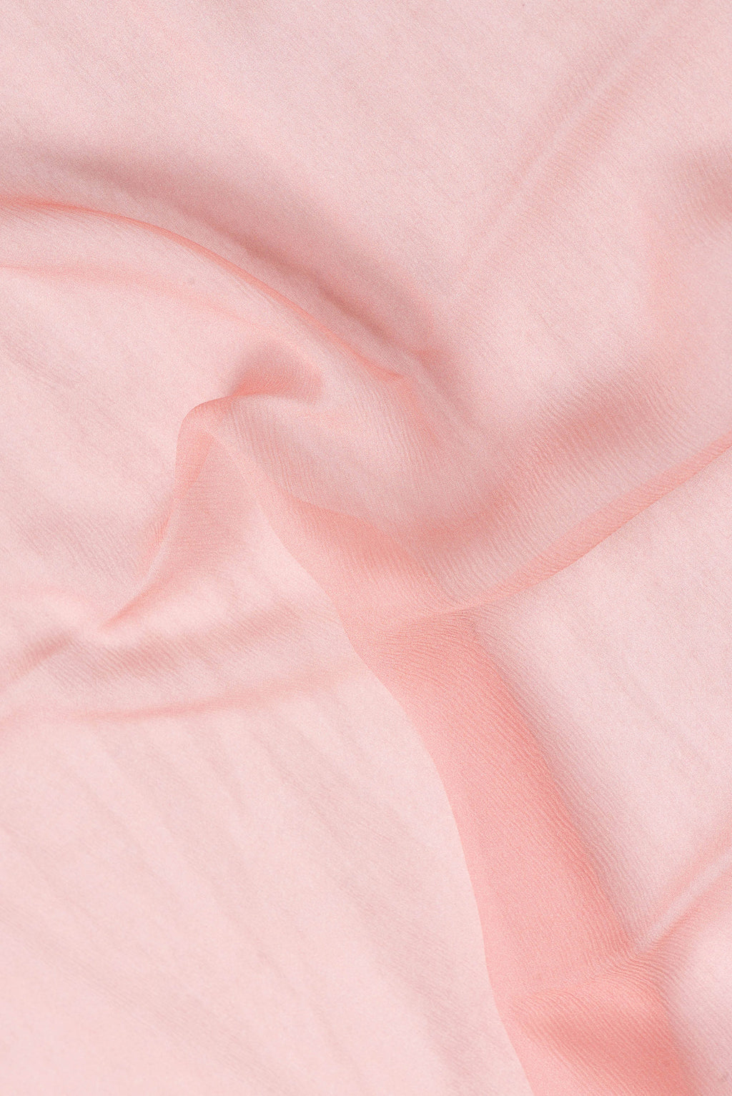 Close up of Pink Dual Tone Mysore Chiffon Saree with Plain Body and Printed Border.  displaying folds