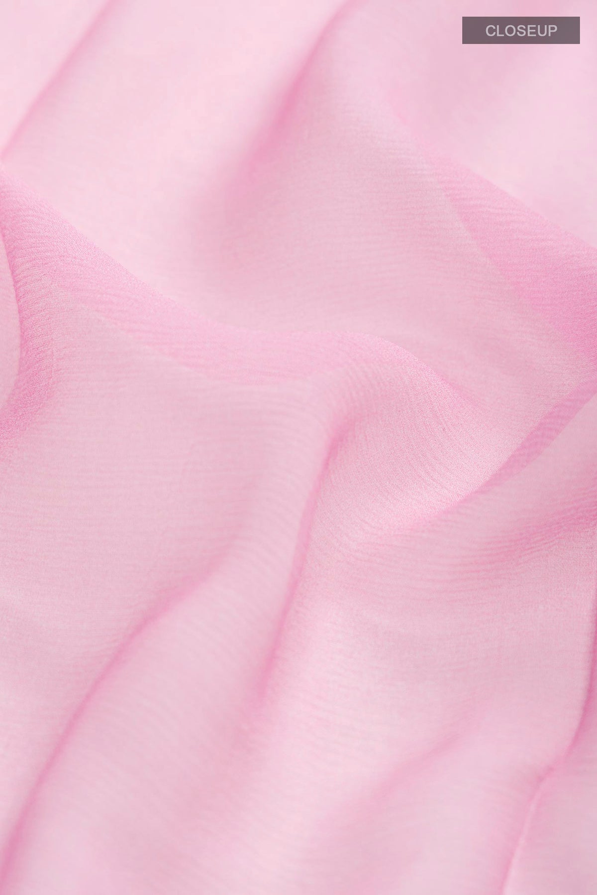 Close up of Rose pink Mysore Chiffon Saree with Plain Body and Embroidery Border displaying folds