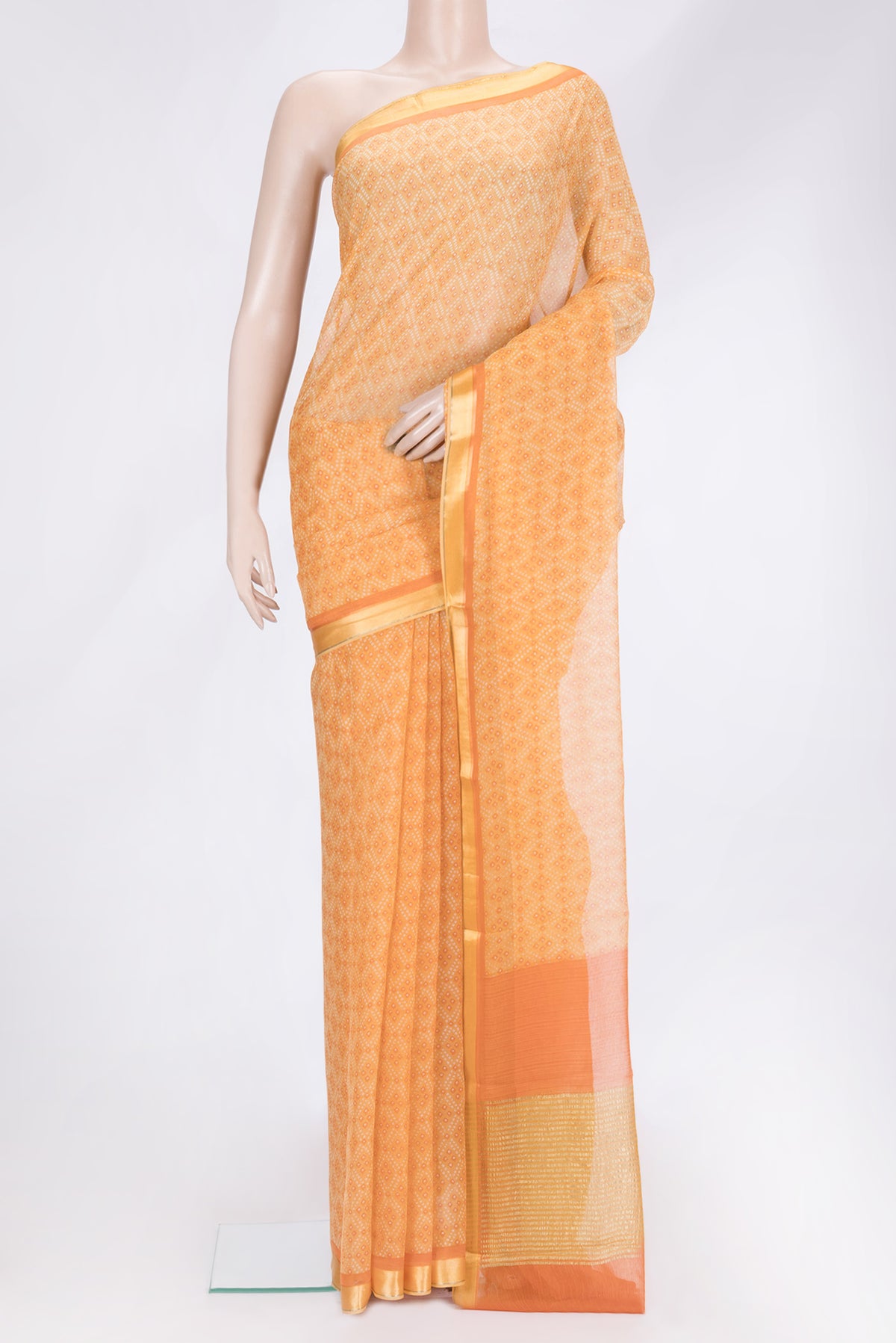 Orange Dual Tone Mysore Chiffon Saree with Printed design on the body and Zari Border.  displayed on a mannequin