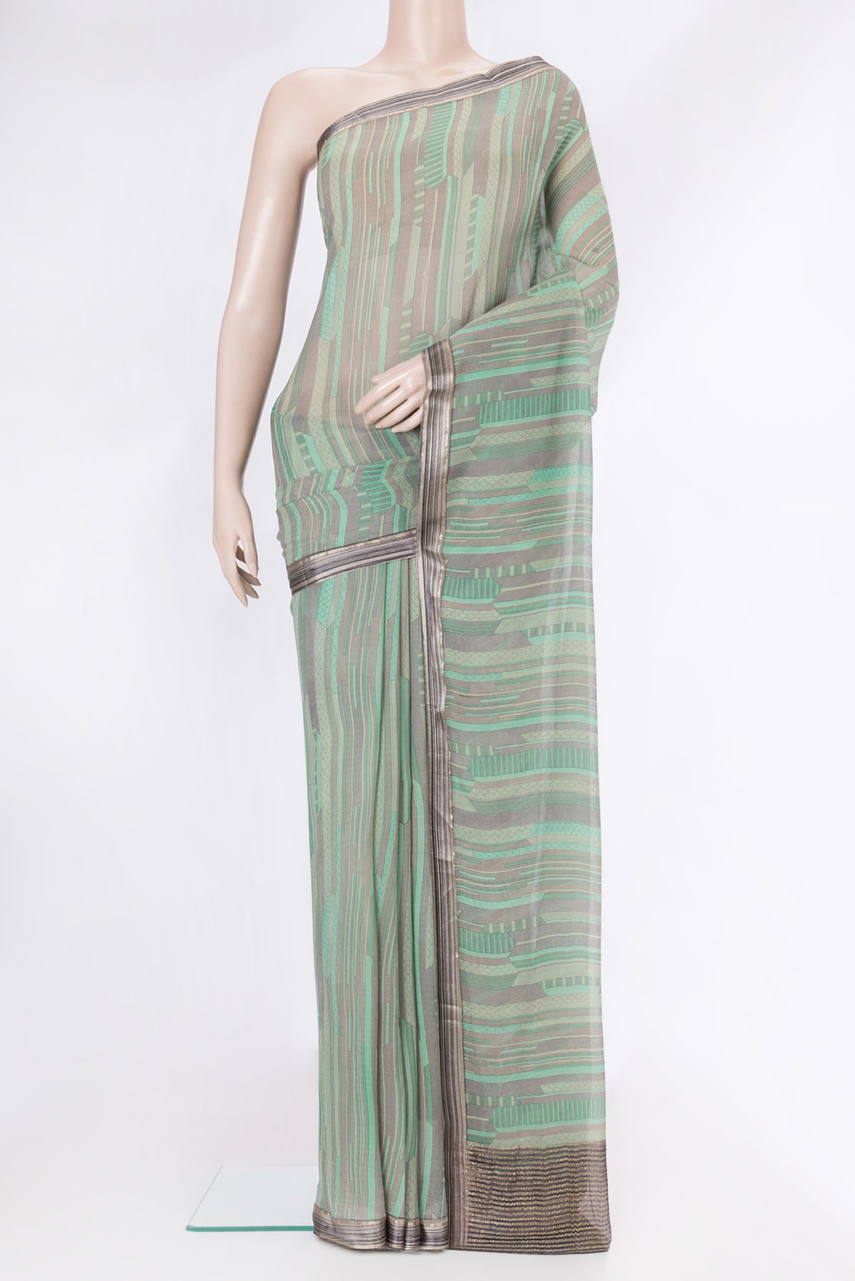 Sea Green Dual Tone Mysore Chiffon Saree with Printed design on the body and Zari Border.  displayed on a mannequin