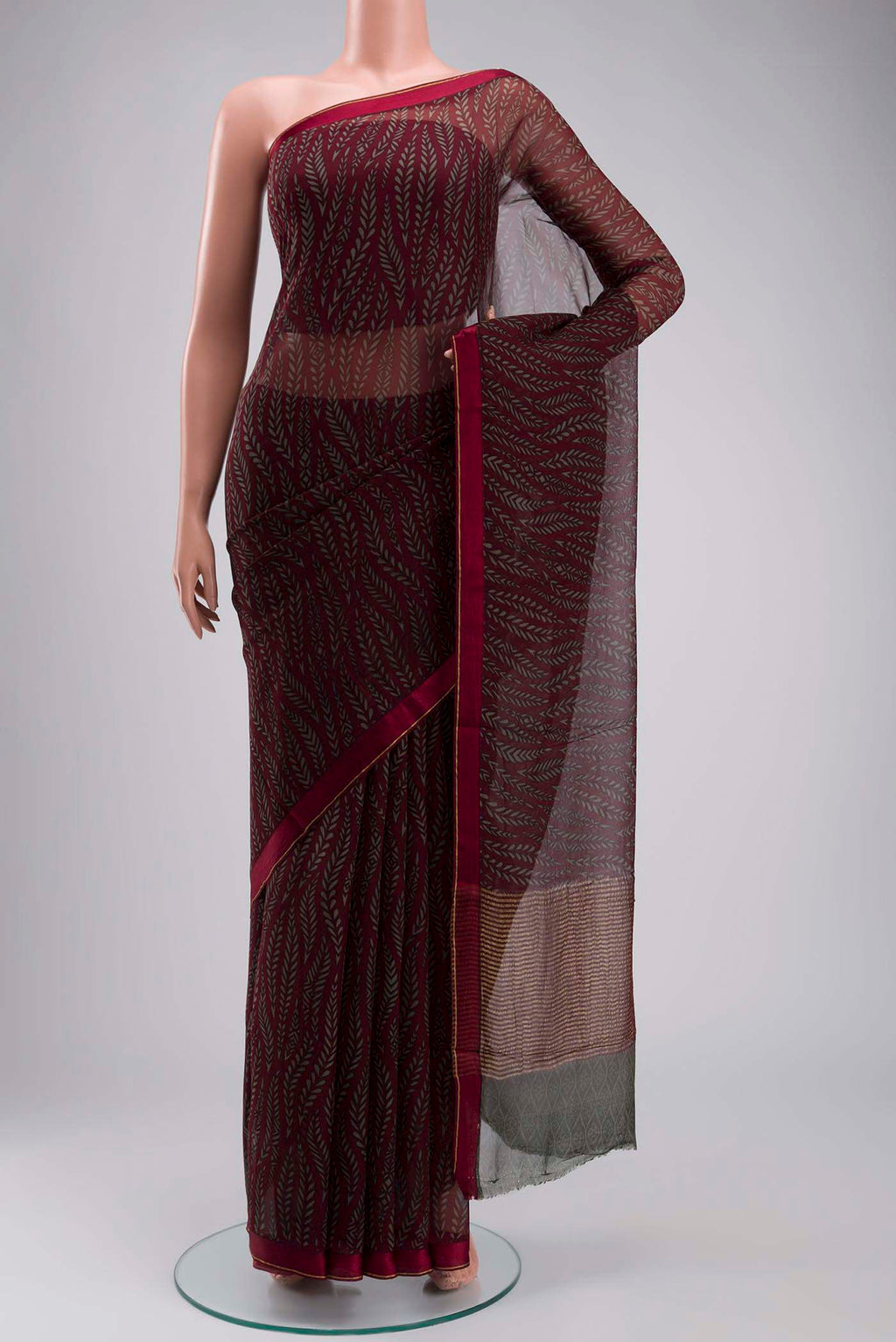 Maroon Mysore Chiffon Saree with Printed design on the body and Plain Border displayed on a mannequin