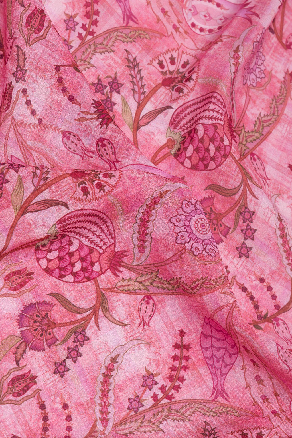 Close up of Pink Crepe Saree with Printed design on the body and Zari Border.  displaying folds