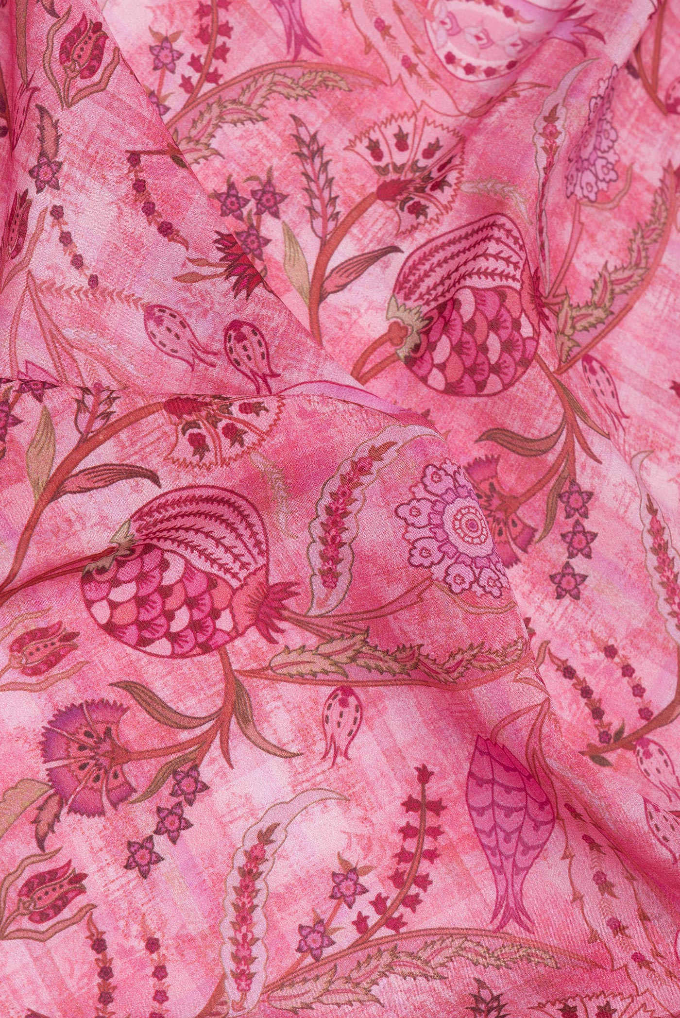 Close up of Pink Crepe Saree with Printed design on the body and Zari Border.  displaying folds