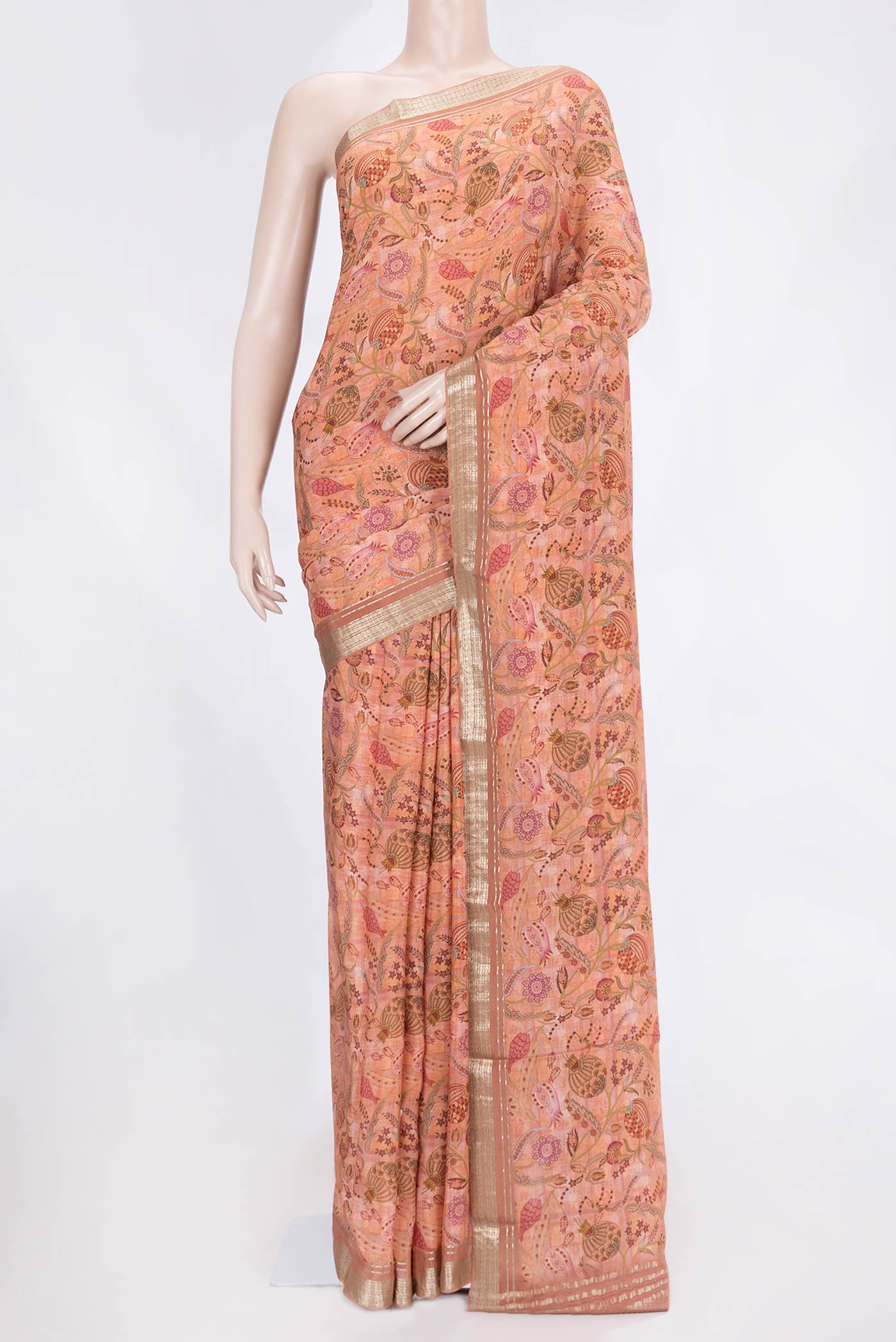 Golden Peach Dual Tone Mysore Crepe Saree with Printed design on the body and Zari Border.  displayed on a mannequin