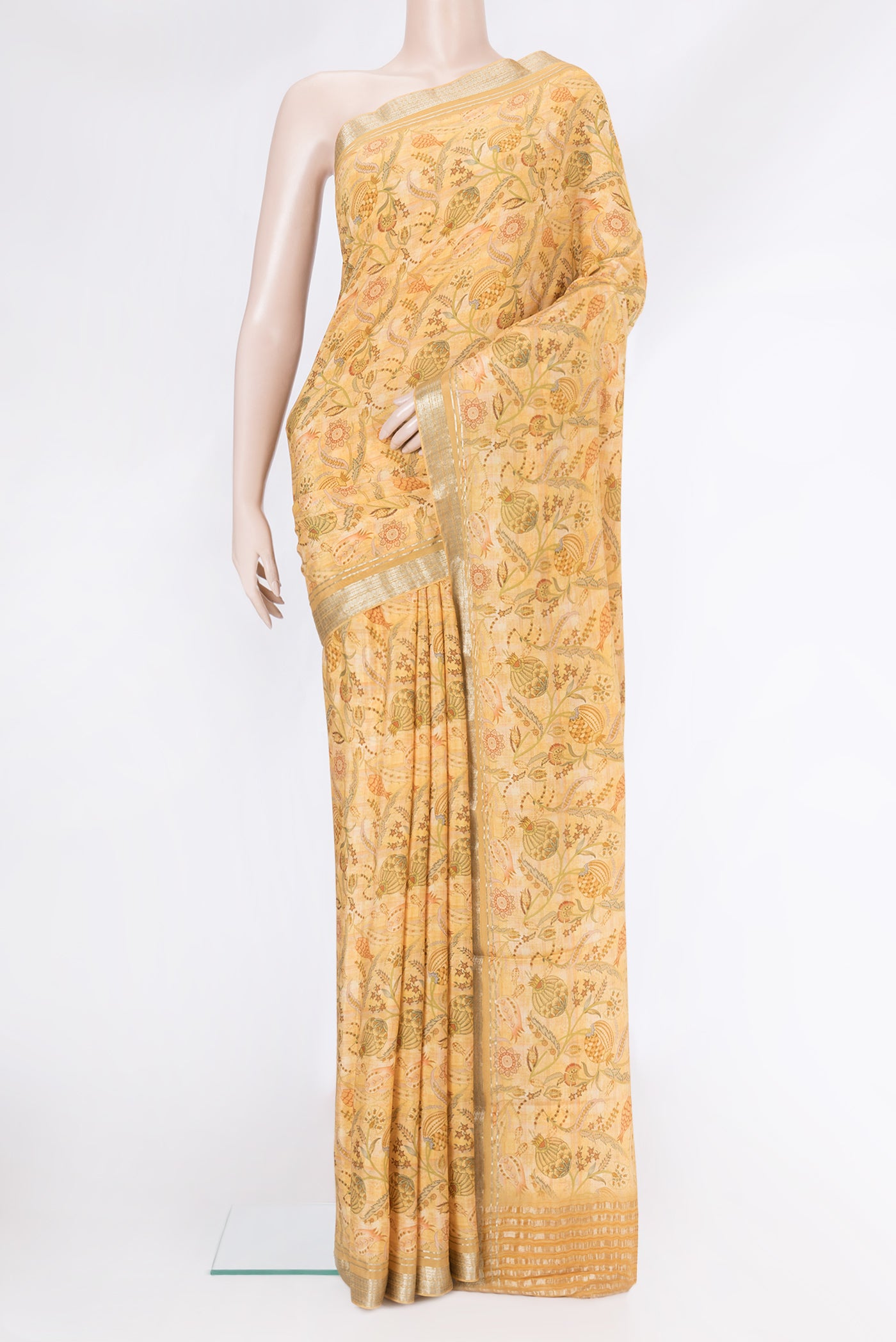 Sandal Dual Tone Mysore Crepe Saree with Printed design on the body and Zari Border.  displayed on a mannequin