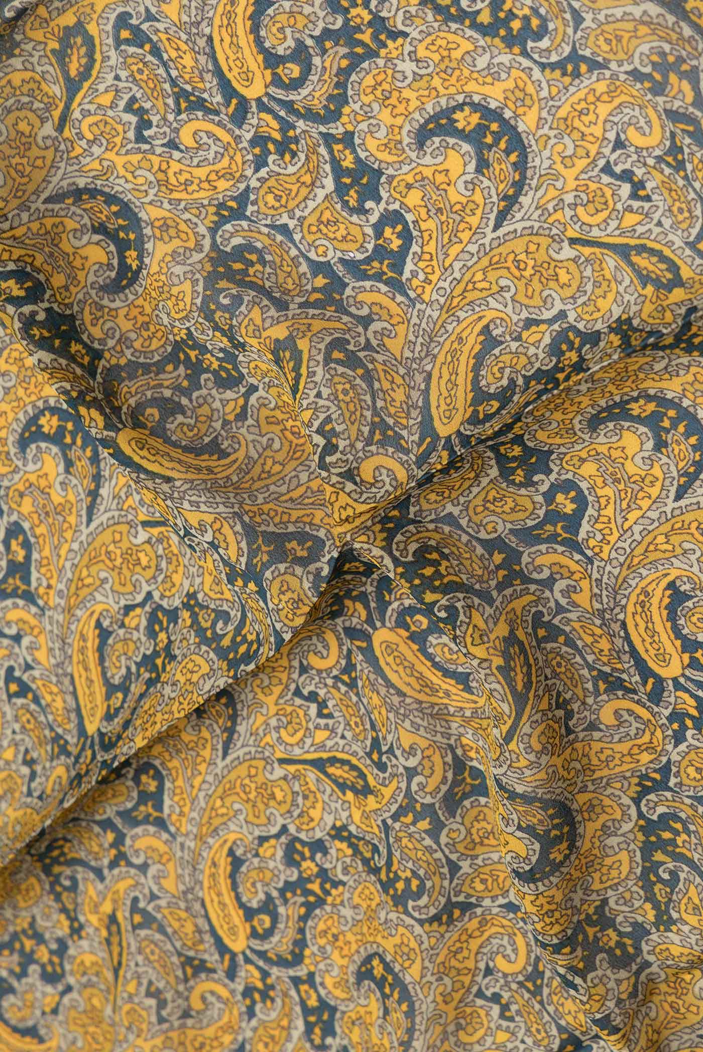 Close up of Green Dual Tone Mysore Crepe Saree with Printed design on the body and Thread Border.  displaying folds