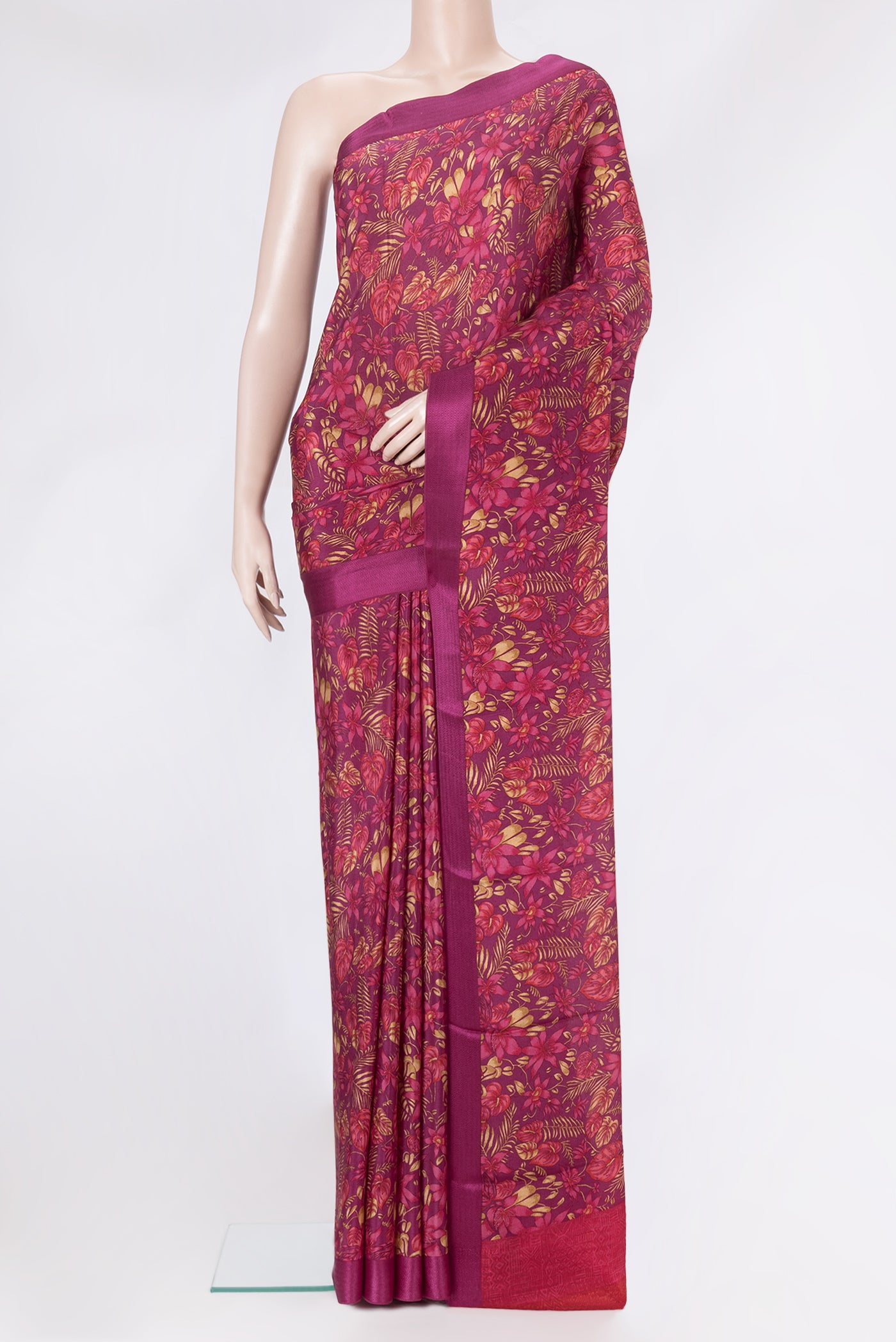 Magenta Dual Tone Crepe Saree with Printed design on the body and Thread Border.  displayed on a mannequin