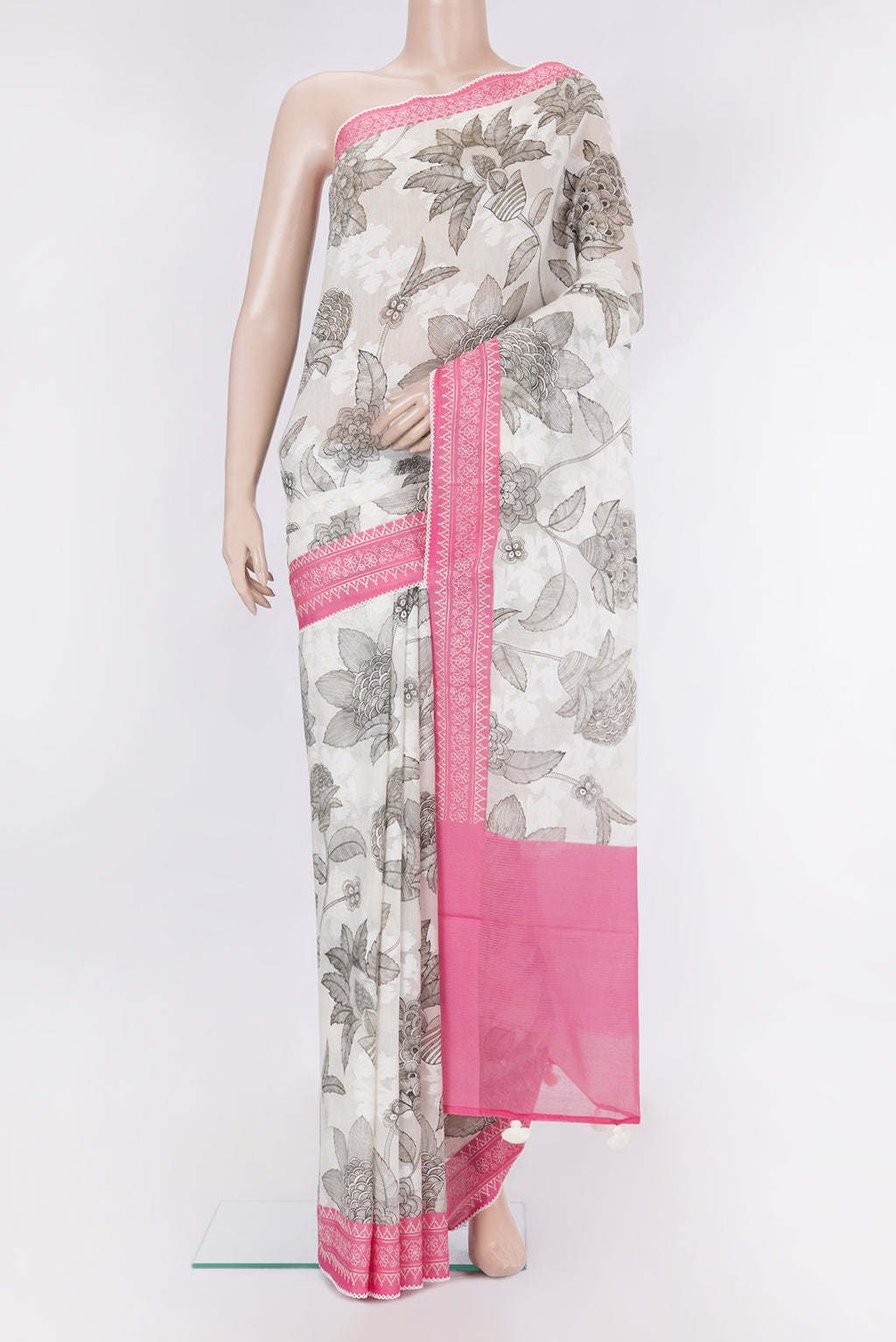 Off White Tussar Silk Saree with Printed design on the body and Embroidery Border.  displayed on a mannequin