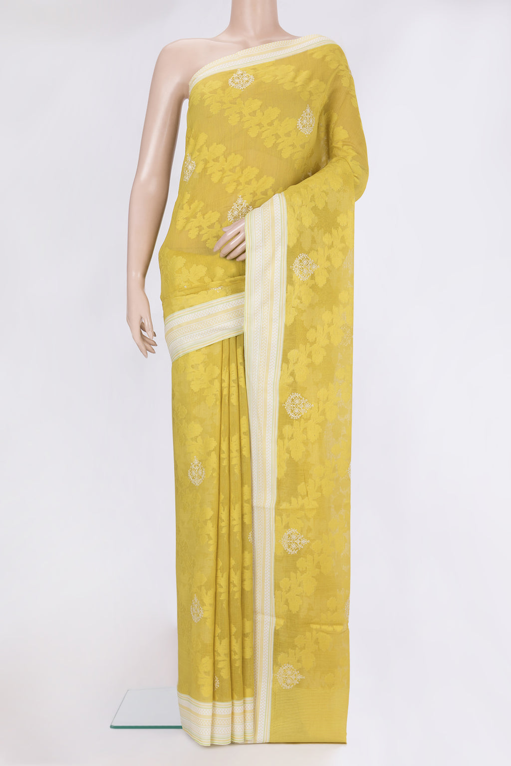 Parrot Green Dual Tone Tussar Silk Saree with Embroidery on the body and Thread Border.  displayed on a mannequin