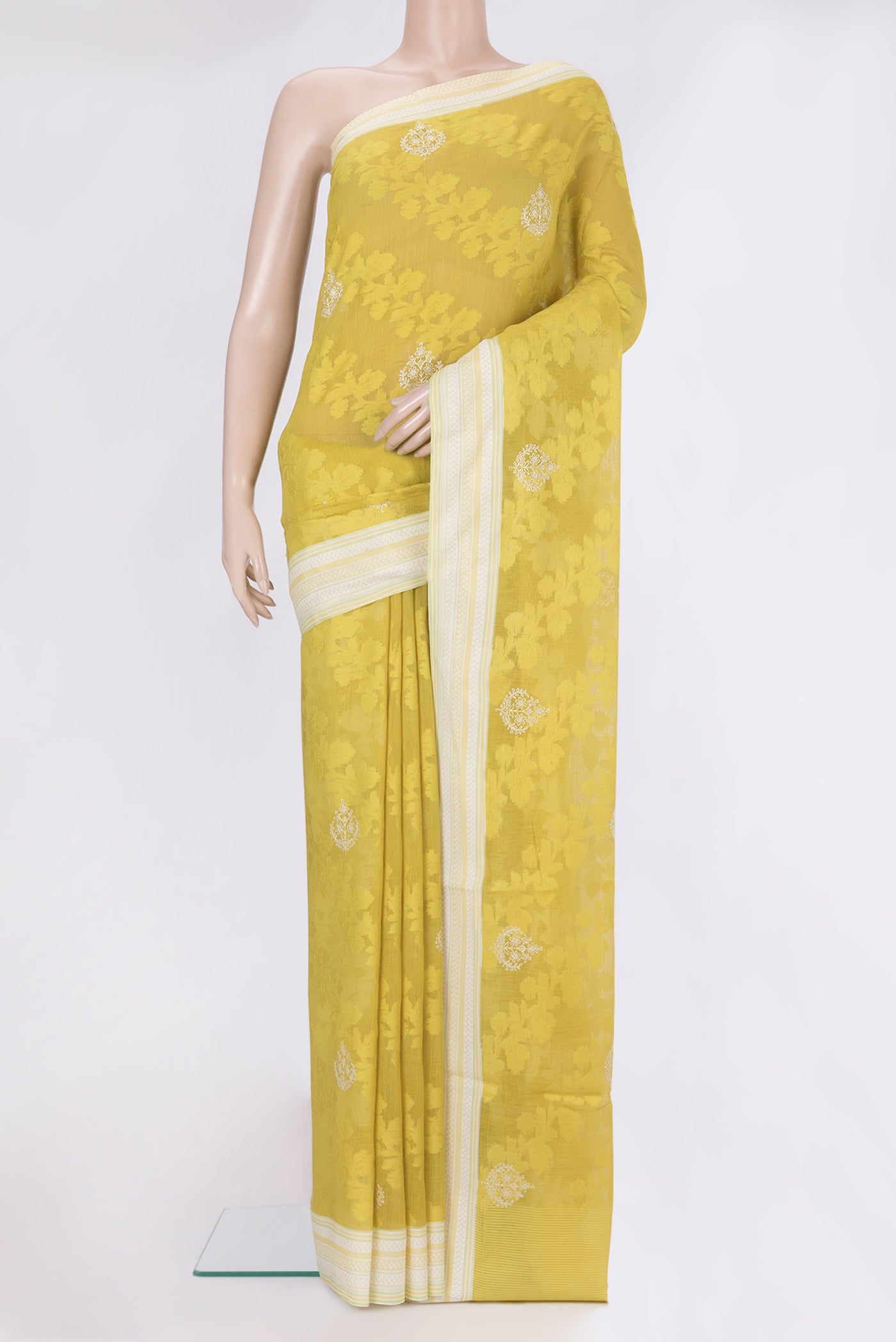 Parrot Green Dual Tone Tussar Silk Saree with Embroidery on the body and Thread Border.  displayed on a mannequin