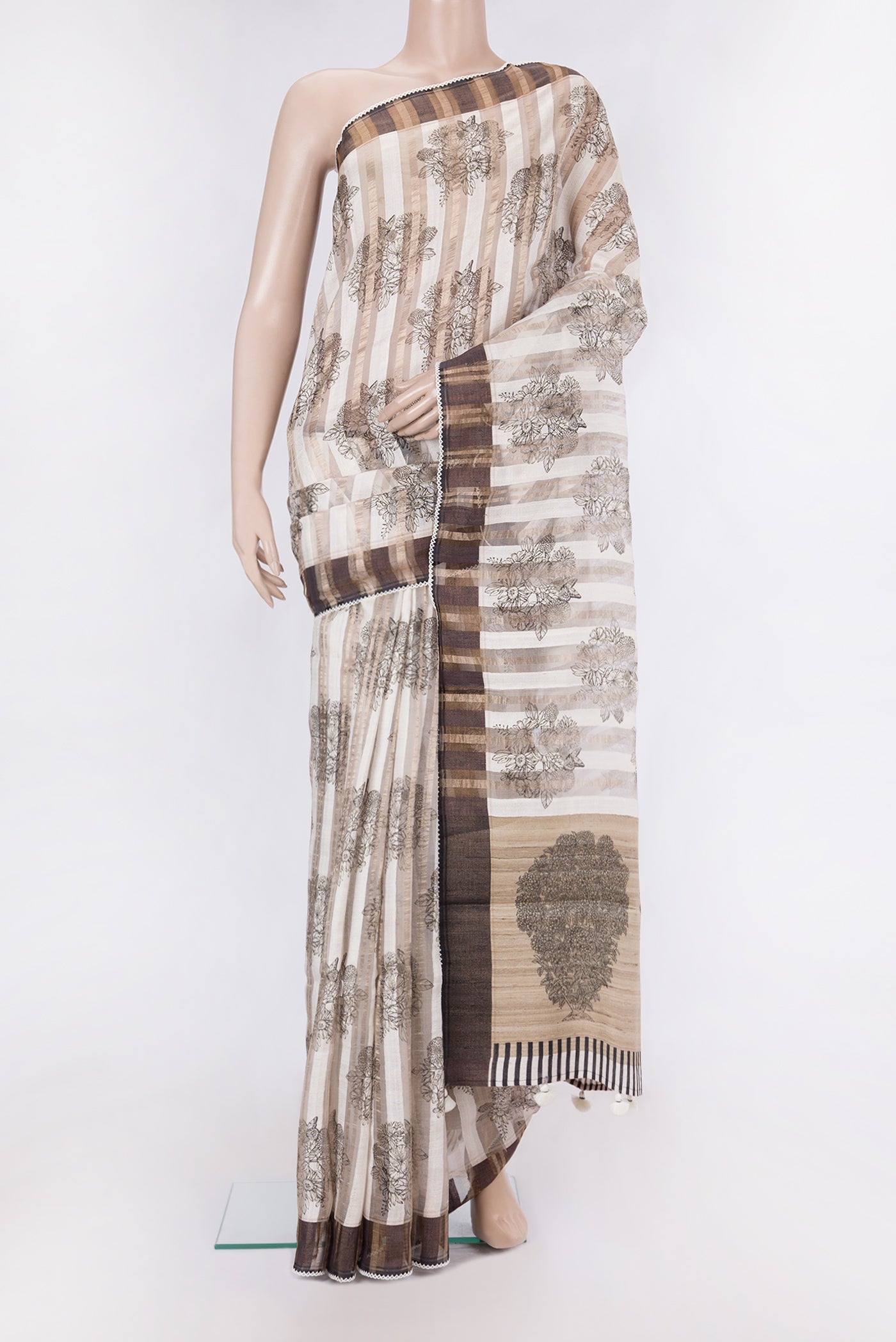 Cream Tussar Silk Saree with Stripes on the body and Embroidery Border.  displayed on a mannequin