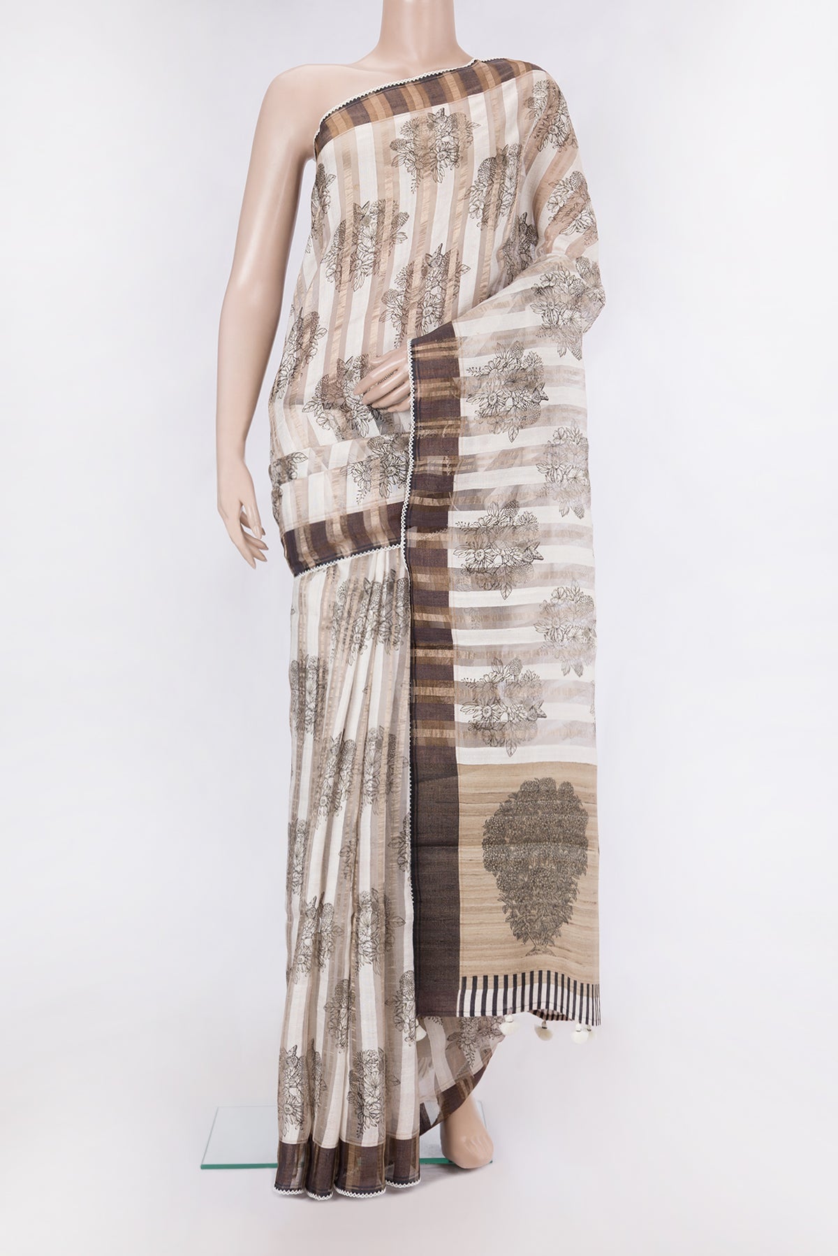 Cream Tussar Silk Saree with Stripes on the body and Embroidery Border.  displayed on a mannequin
