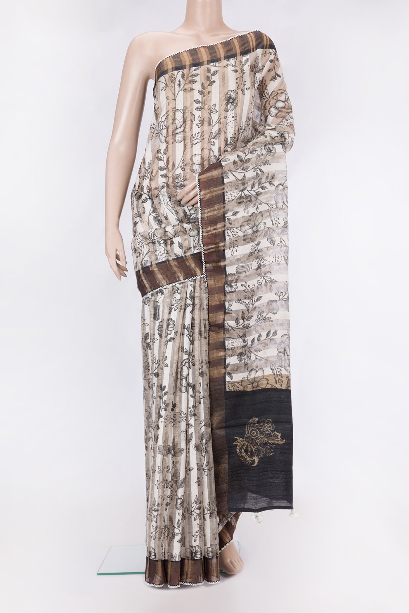 Beige Dual Tone Tussar Silk Saree with Stripes on the body and Embroidery Border.  displayed on a mannequin