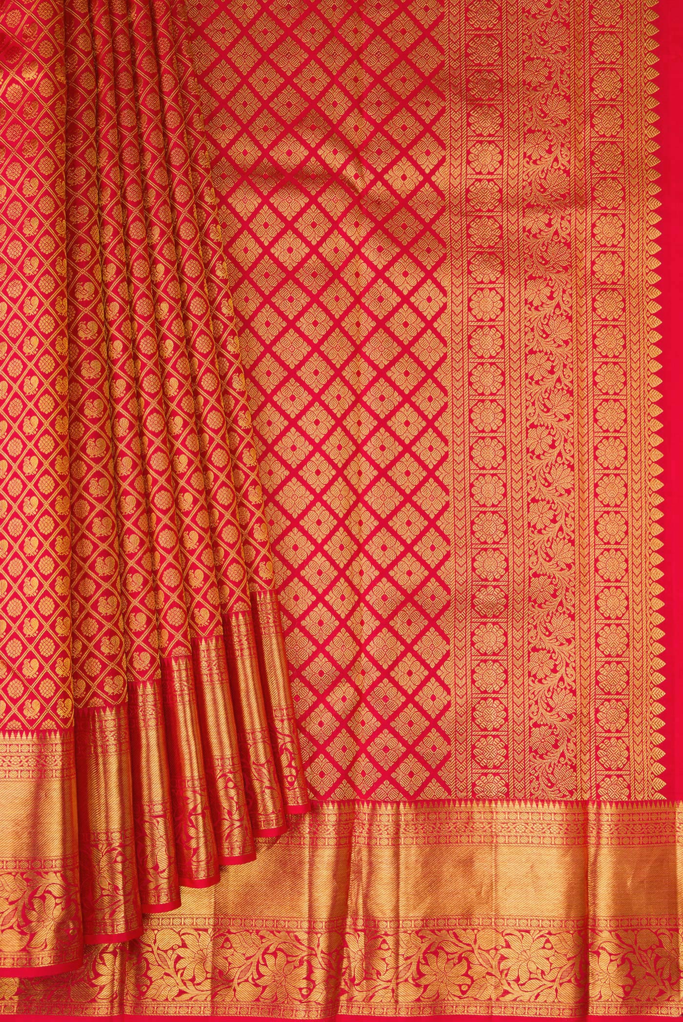 Pleats and pallu of Red Kanchipuram Silk Saree with Zari Brocade on the body and Fancy Border. 