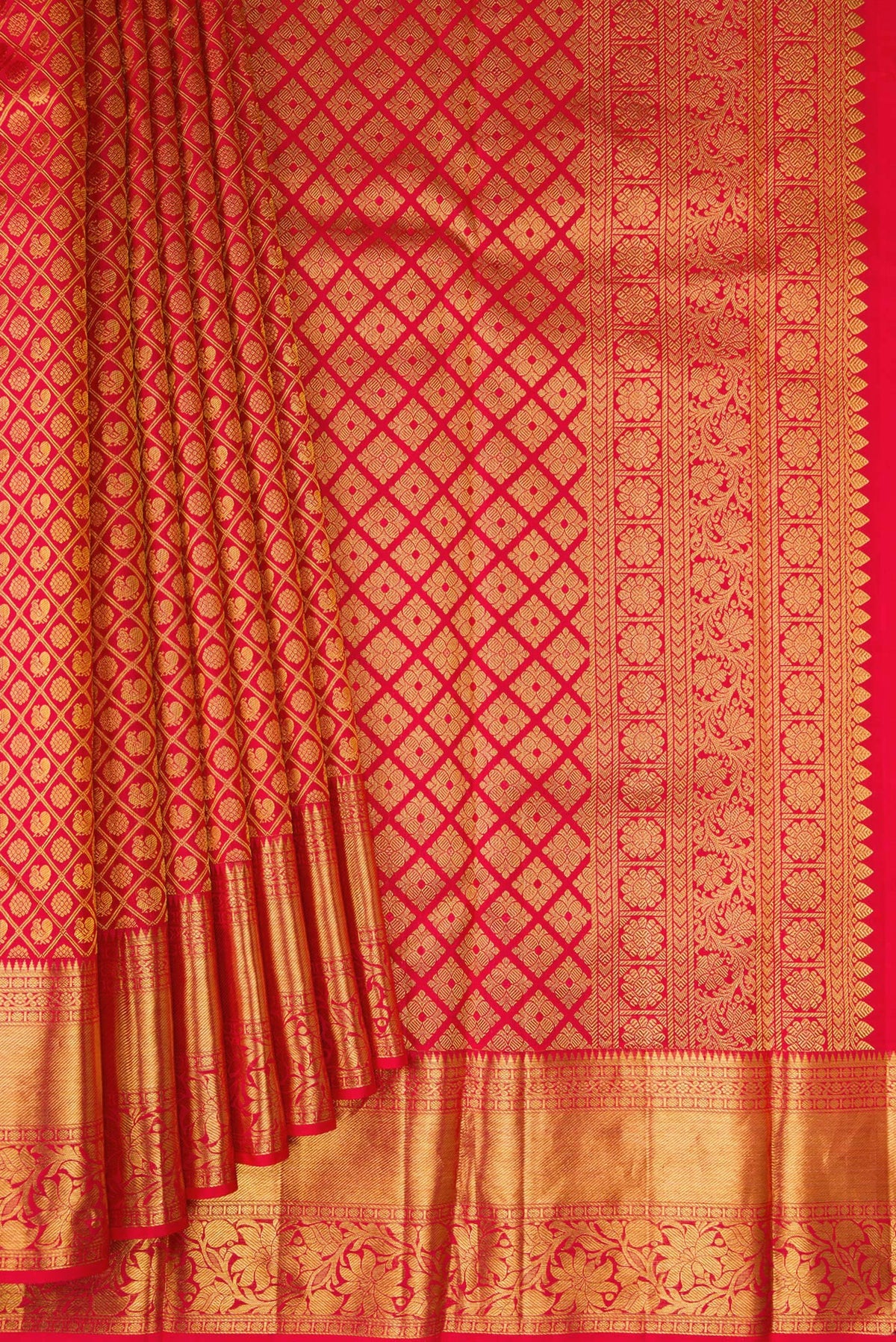 Pleats and pallu of Red Kanchipuram Silk Saree with Zari Brocade on the body and Fancy Border. 