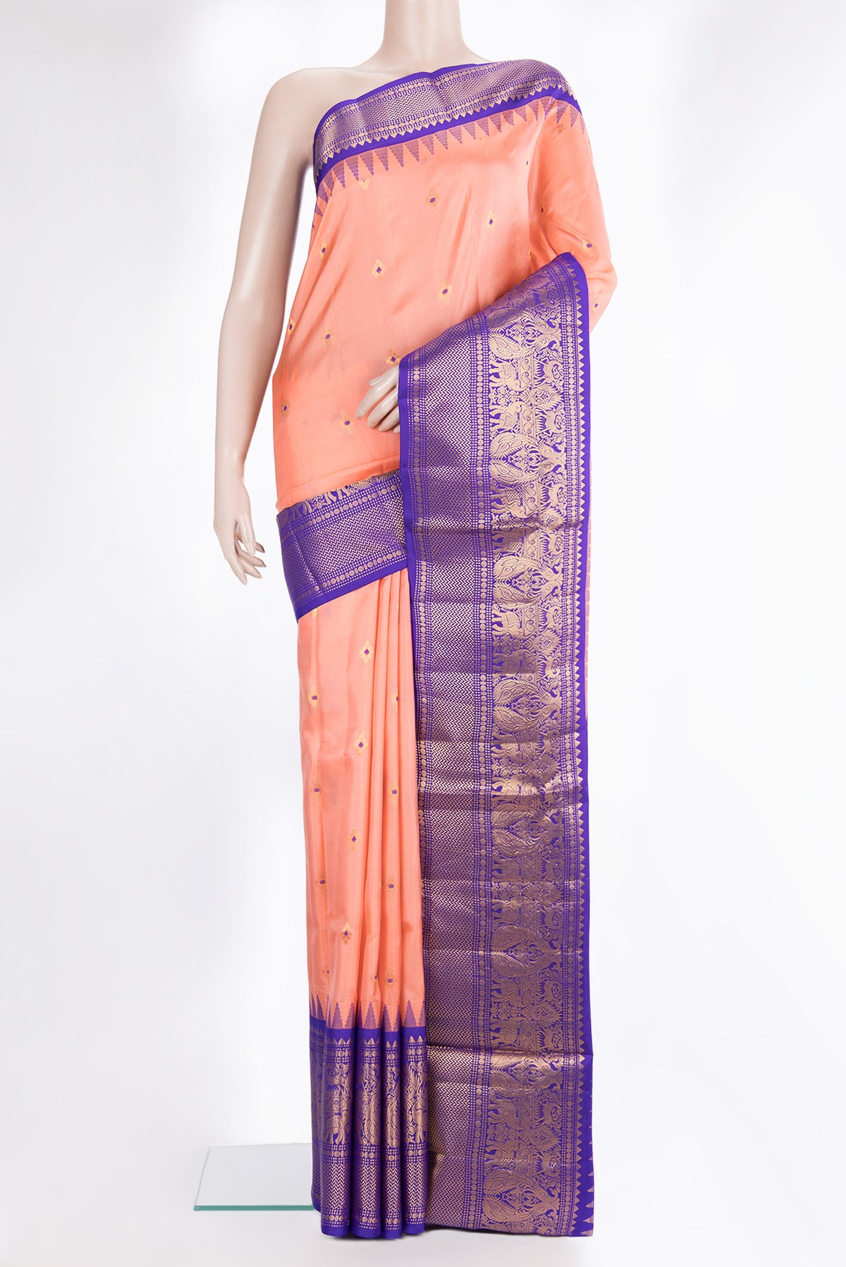 Pure Silk Peach Dual Tone Soft Saree with Zari And Thread Butta on the body and Fancy Border.  displayed on a mannequin