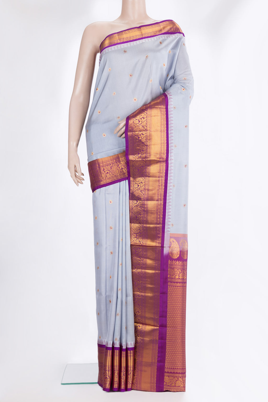 Pure Silk Grey Dual Tone Soft Saree with Zari And Thread Butta on the body and Fancy Border.  displayed on a mannequin