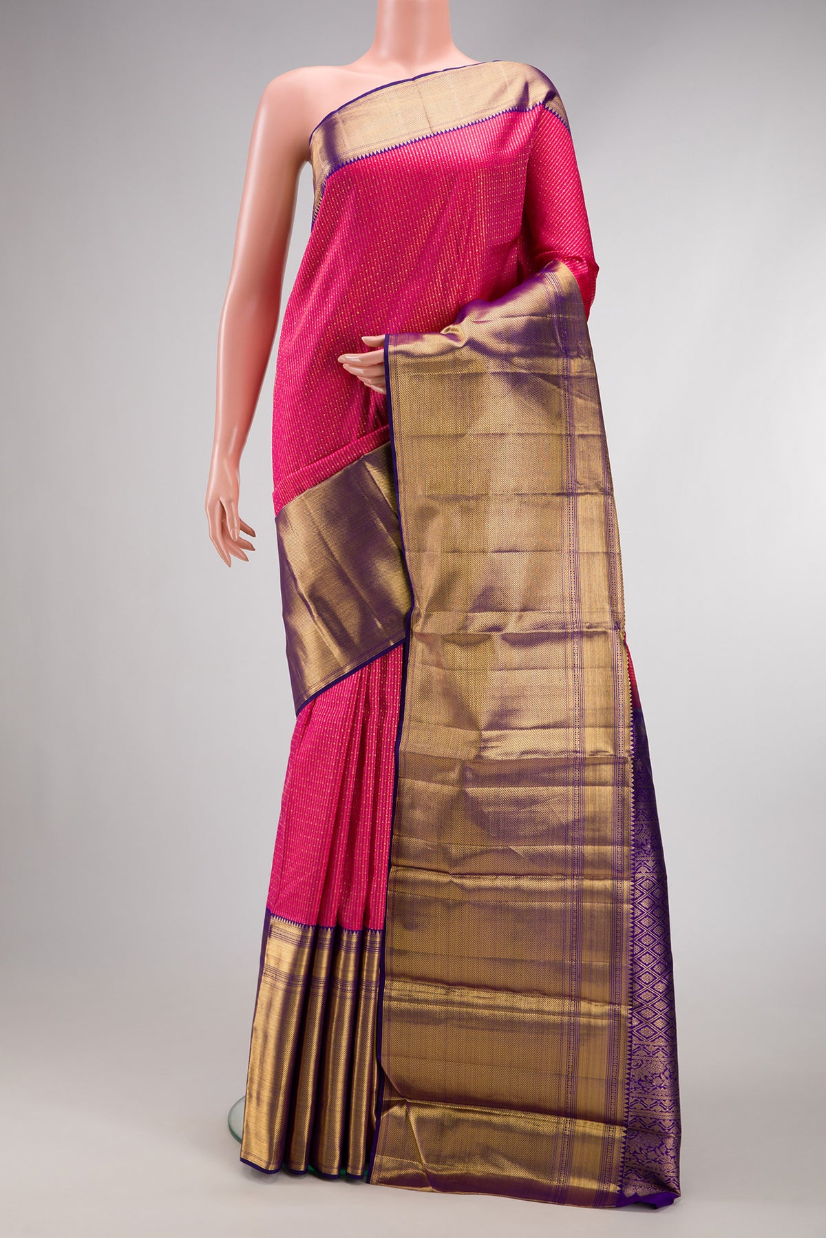 Pink Dual Tone Kanchipuram Silk Saree with Zari Brocade on the body and Zari Border.  displayed on a mannequin