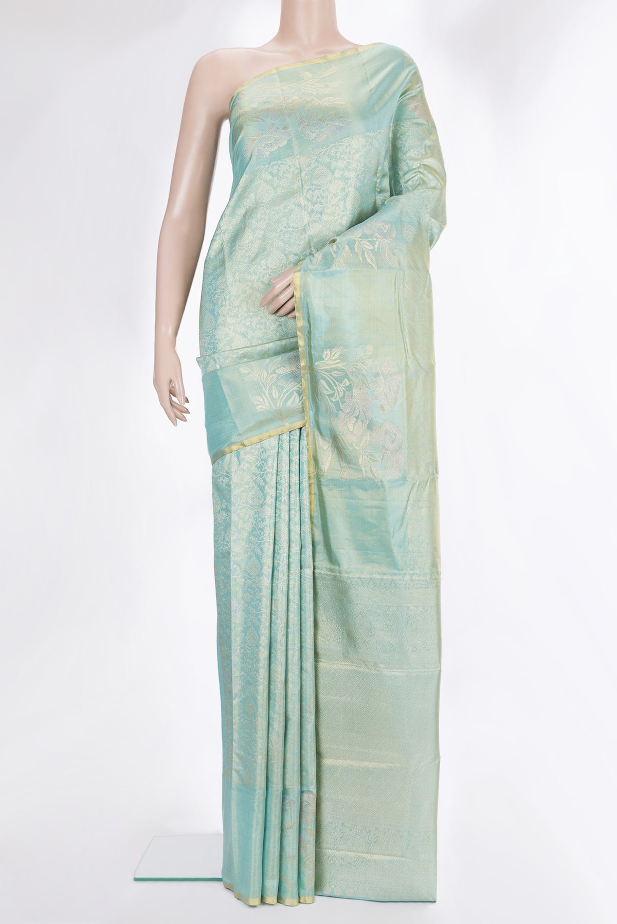 Light Green Dual Tone Kanchipuram Tissue Saree with Zari Brocade on the body and Fancy Border.  displayed on a mannequin