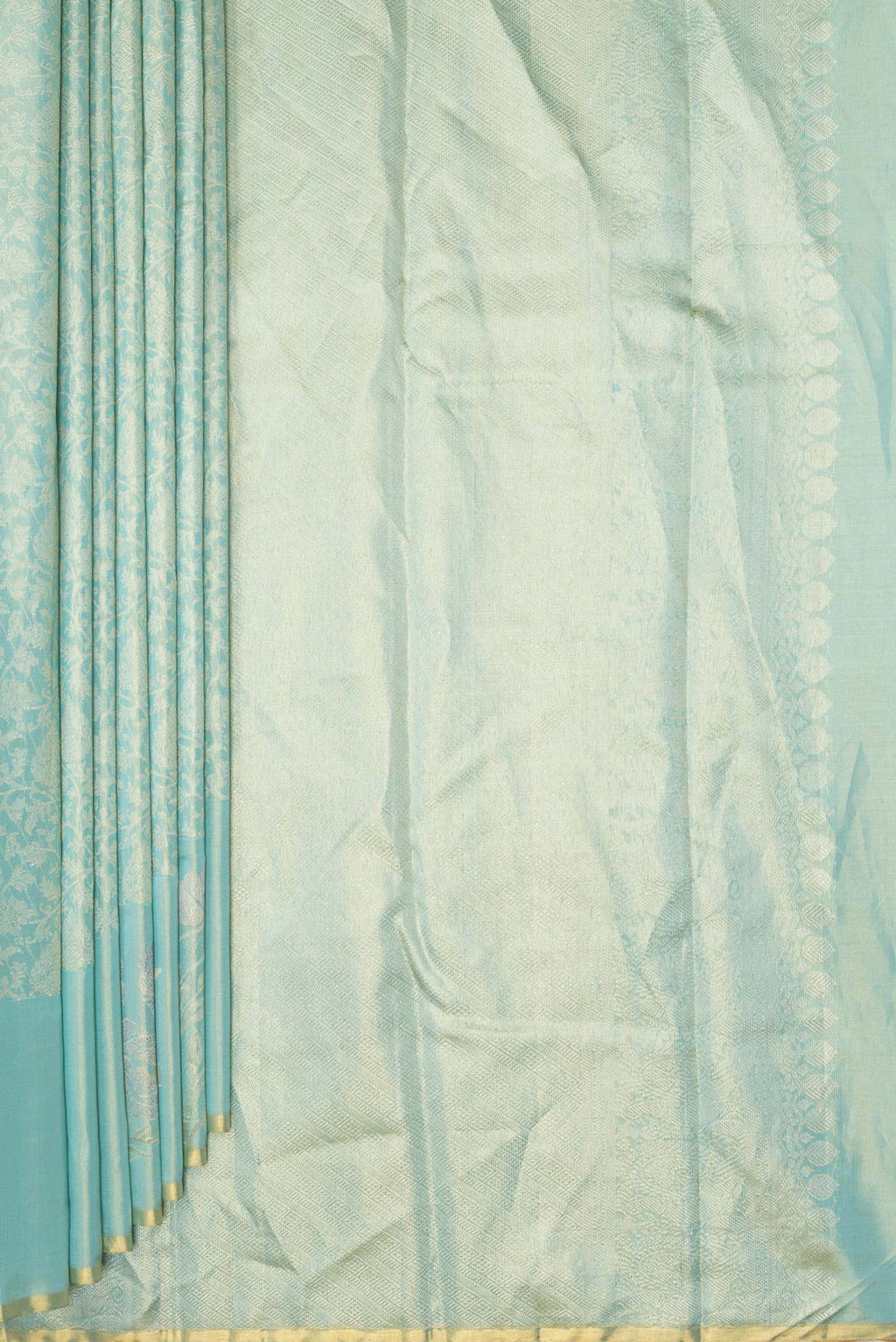 Pleats and pallu of Light Green Dual Tone Kanchipuram Tissue Saree with Zari Brocade on the body and Fancy Border. 