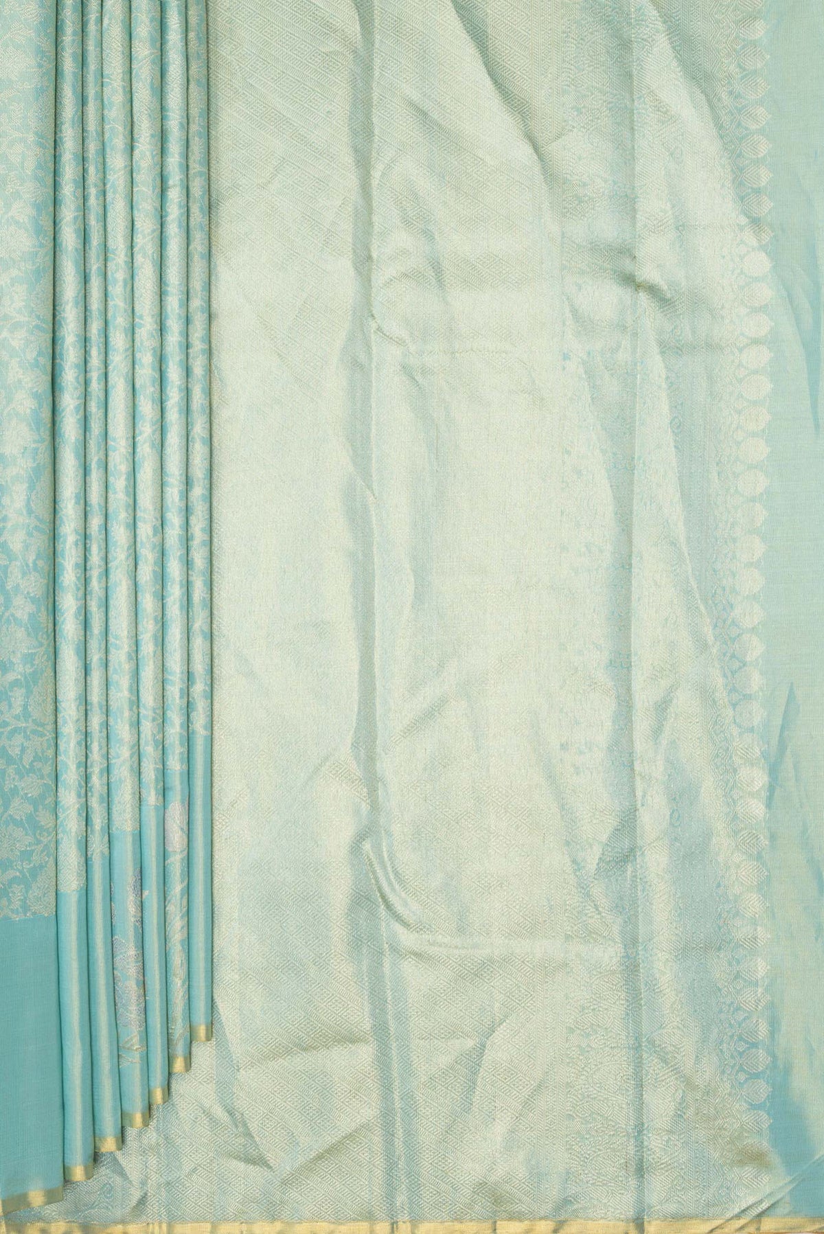 Pleats and pallu of Light Green Dual Tone Kanchipuram Tissue Saree with Zari Brocade on the body and Fancy Border. 