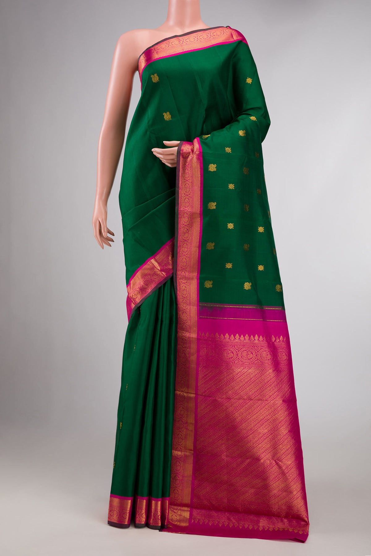 Bottle Green Dual Tone Kanchipuram Silk Saree with Zari Butta on the body and Zari Border displayed on a mannequin