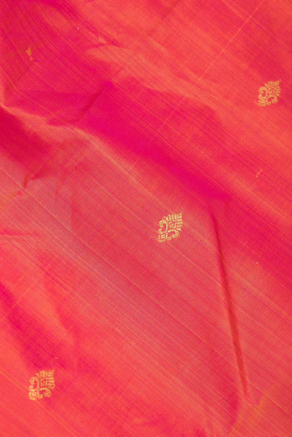 Close up of Pink Dual Tone Kanchipuram Silk Saree with Zari Butta on the body and Zari Border displaying folds
