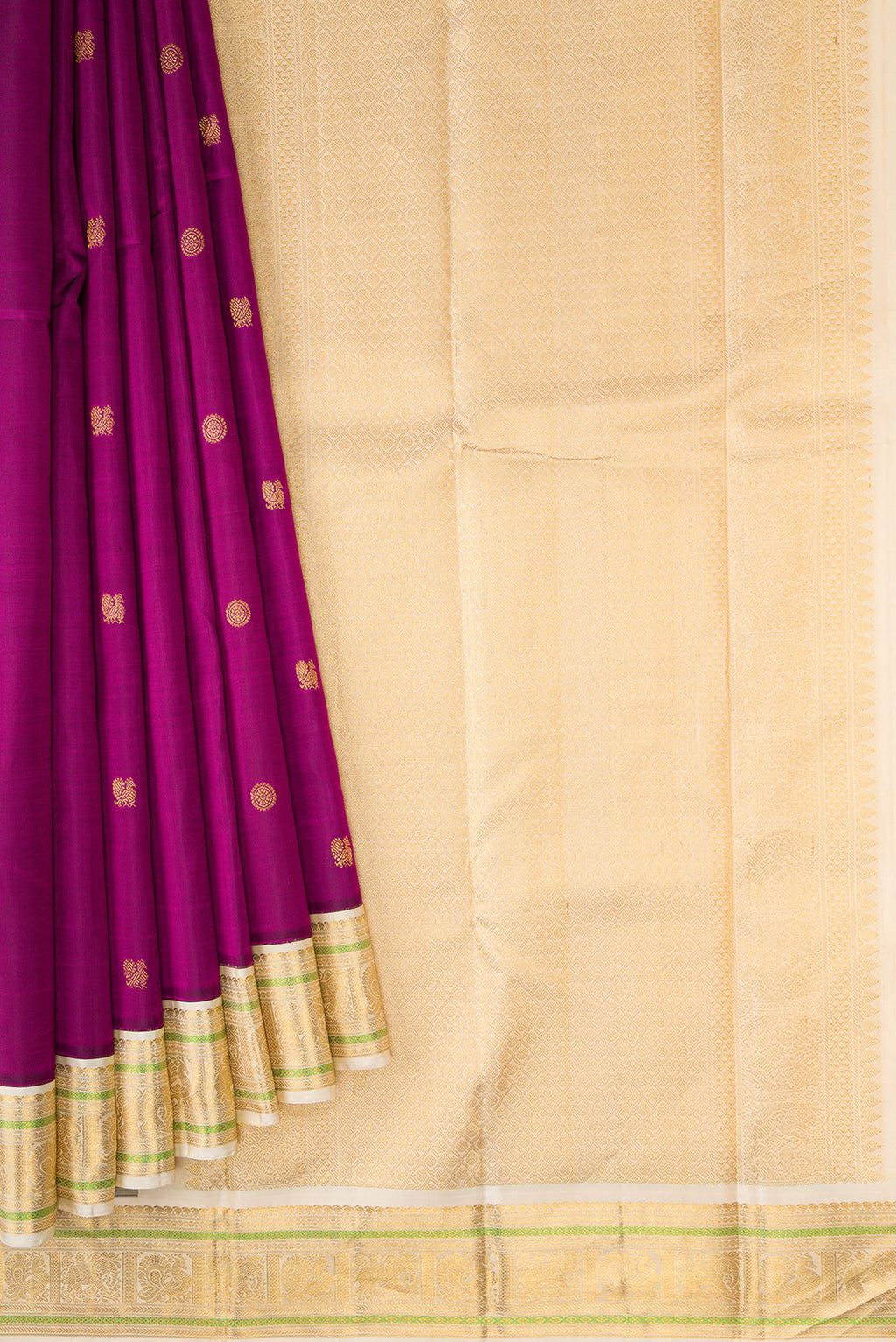 Pleats and pallu of Pure Silk Pure Zari Magenta Dual Tone Kanjivaram Saree with Zari Butta on the body and Zari Border. 