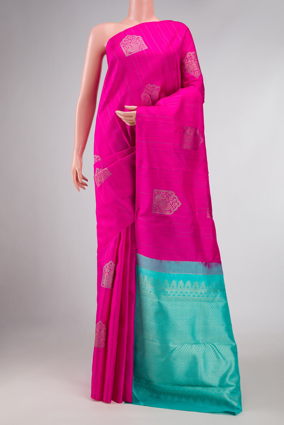 Dark Pink Dual Tone Kanchipuram Silk Saree with Zari And Thread Butta on the body and Without Border displayed on a mannequin