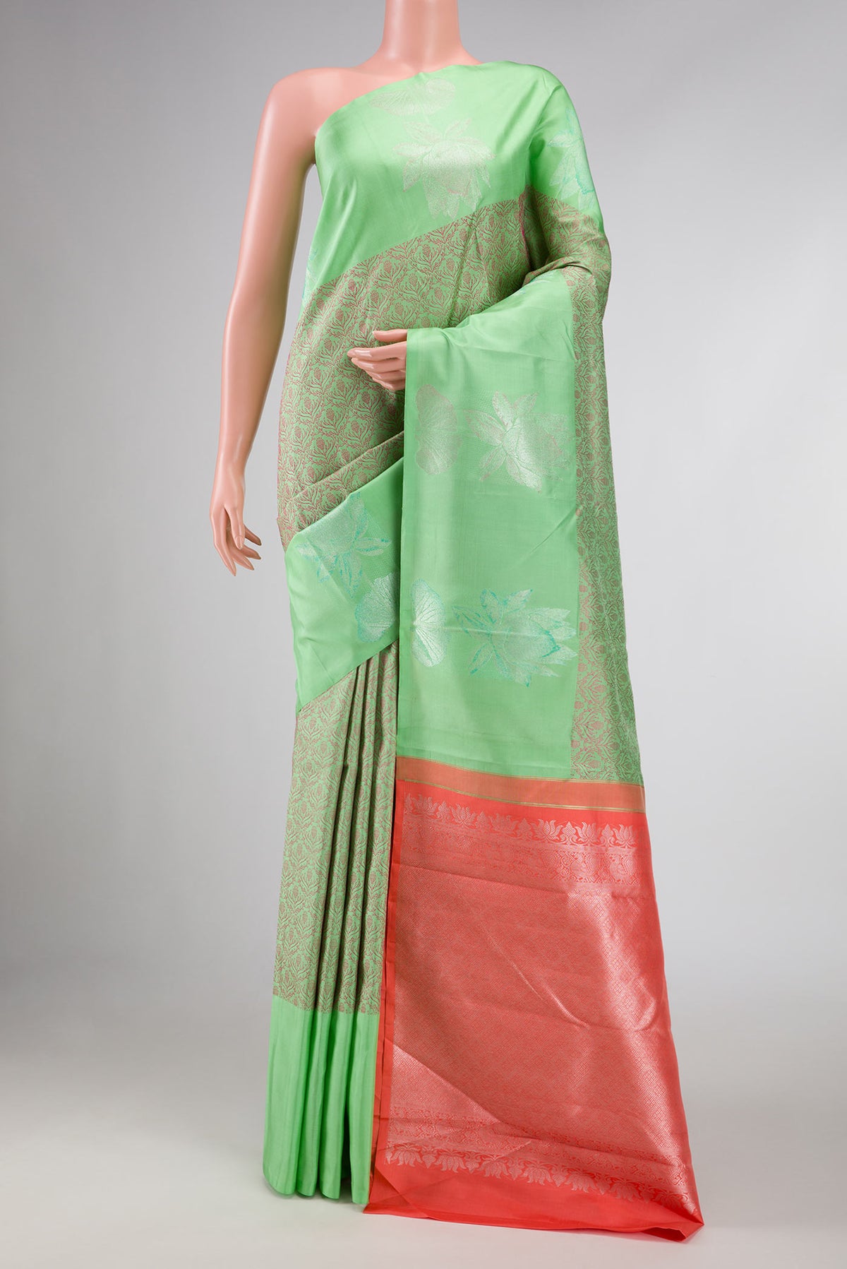 Parrot Green Dual Tone Kanchipuram Silk Saree with Jacquard design on the body and Fancy Border displayed on a mannequin