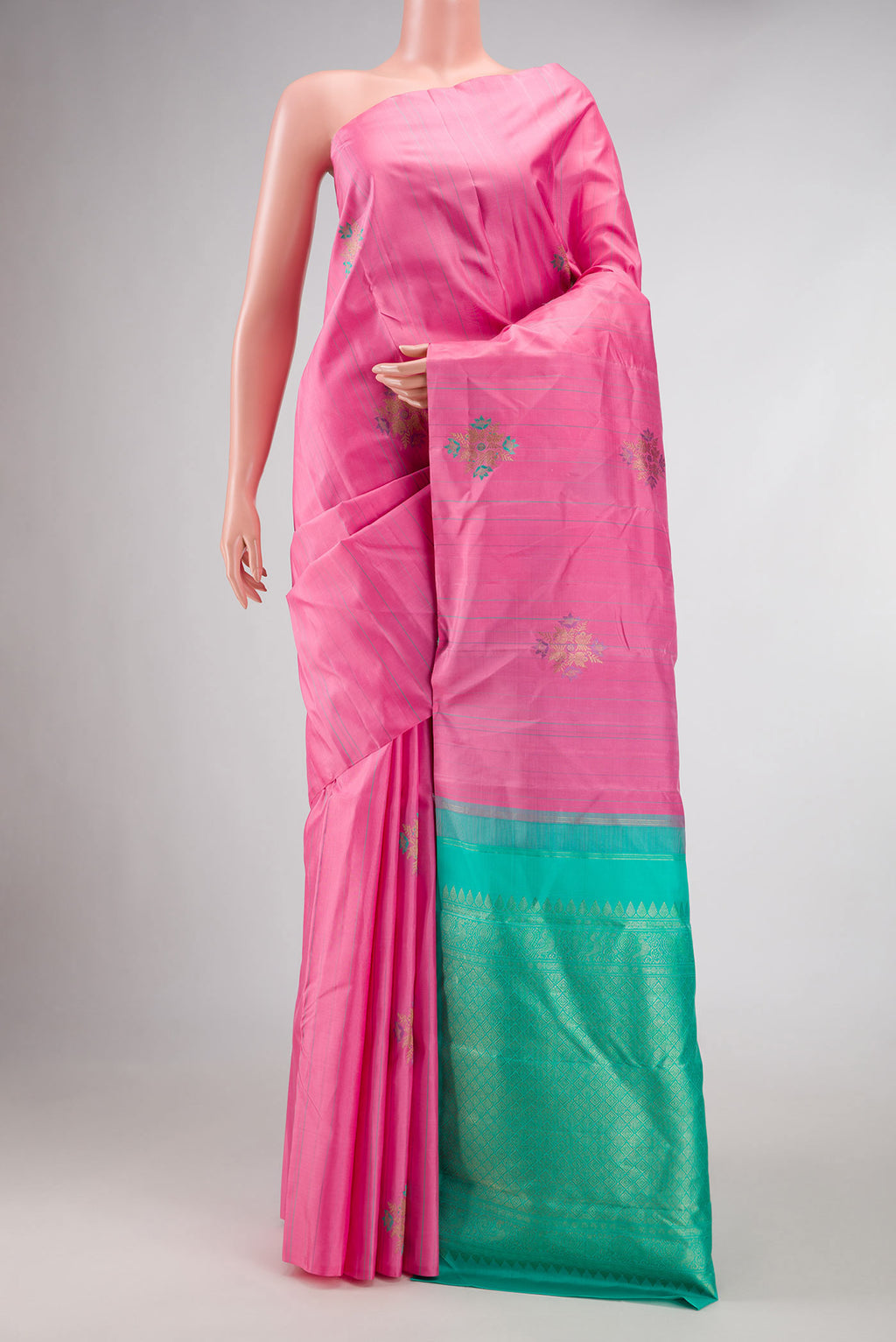 Pure Silk Pure Zari Pink Dual Tone Kanchipuram Saree with Zari And Thread Butta on the body and Without Border displayed on a mannequin